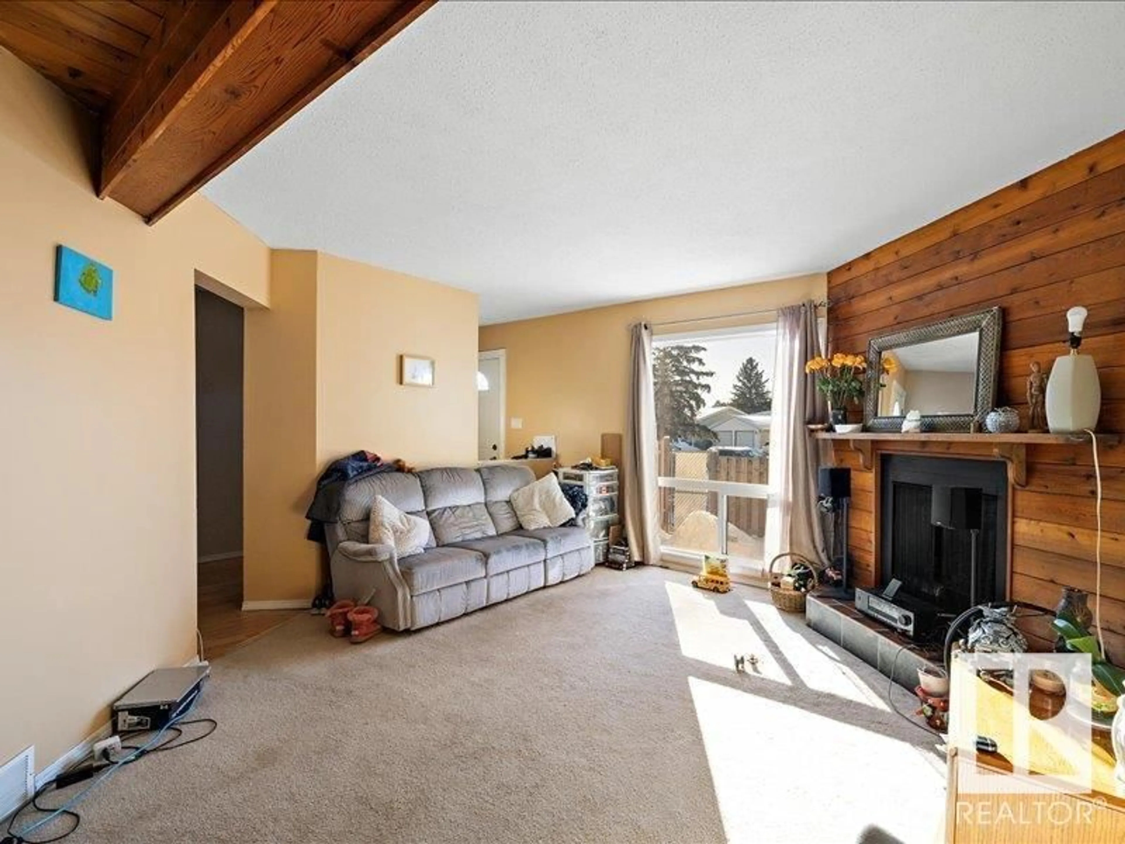 Living room with furniture, wood/laminate floor for 8620 38A AV NW, Edmonton Alberta T6K2Z9