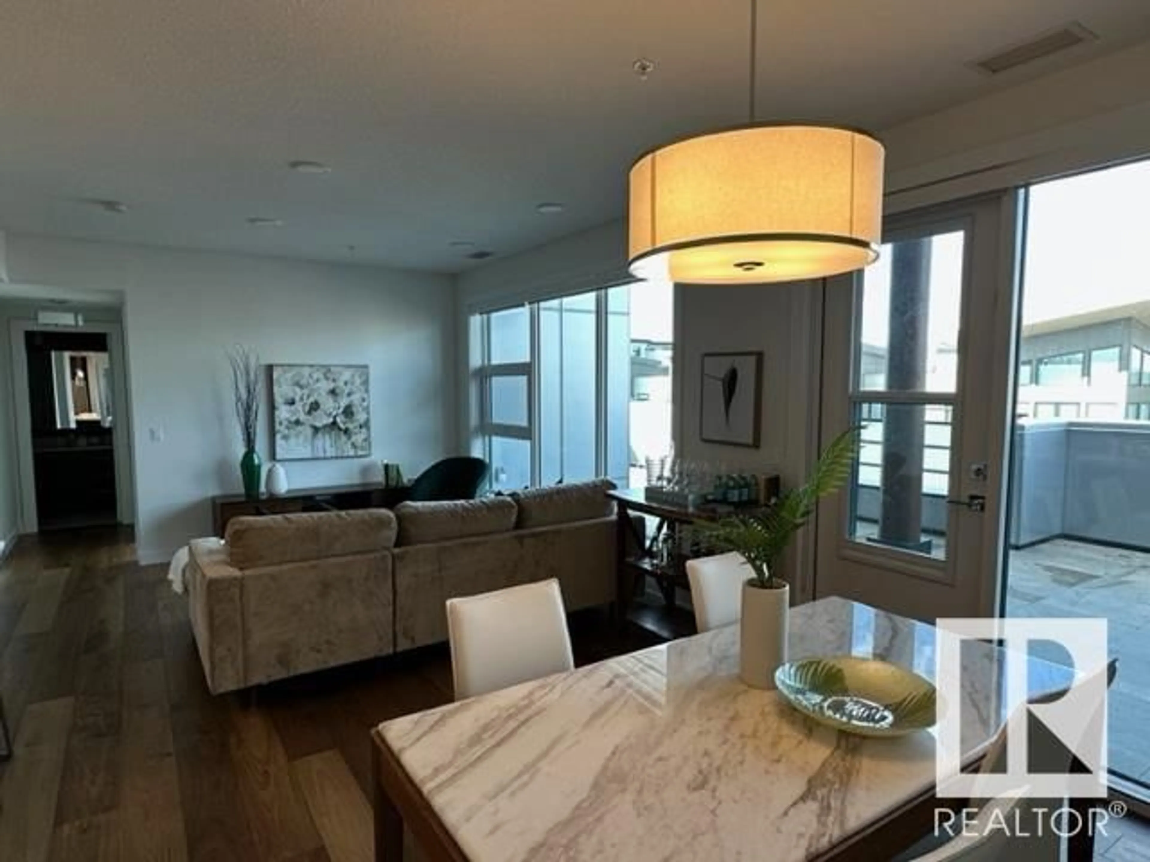 Living room with furniture, wood/laminate floor for #410 61 FESTIVAL WY, Sherwood Park Alberta T8A4Y9