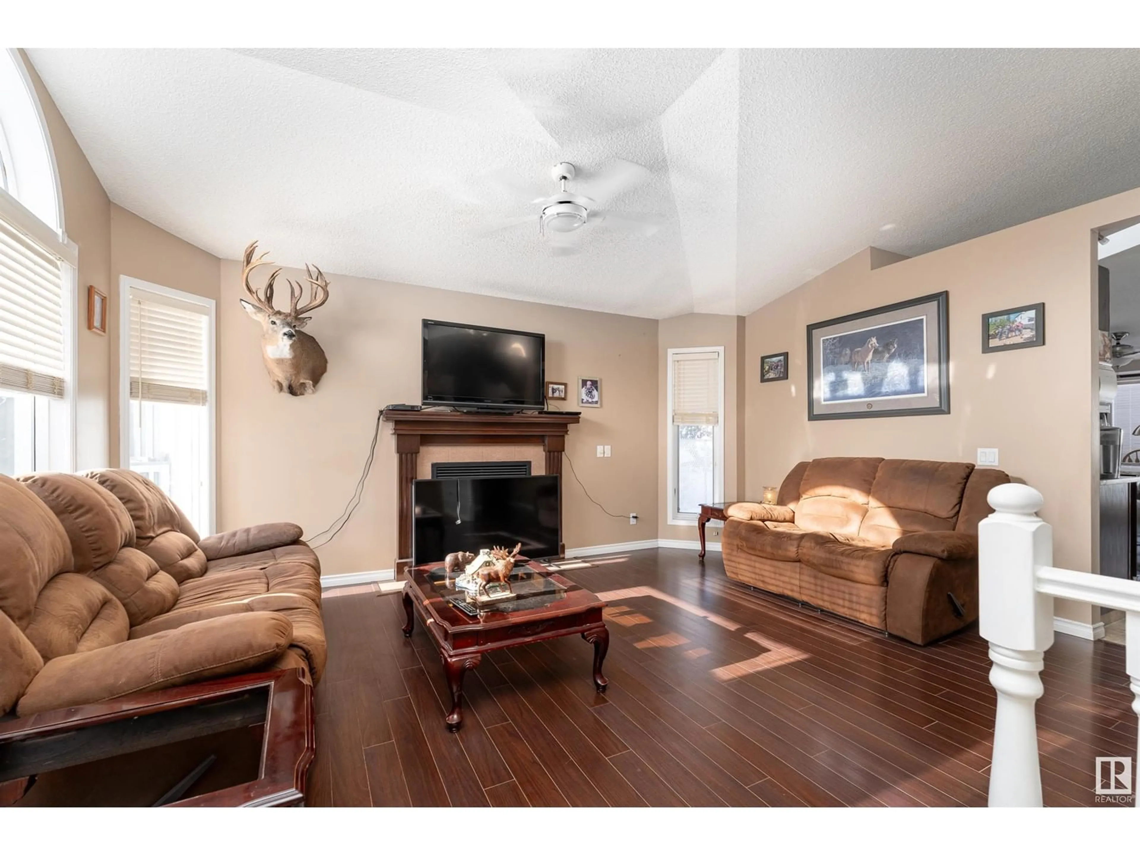 Living room with furniture, wood/laminate floor for 20 LINDSAY CR, Spruce Grove Alberta T7X3W8