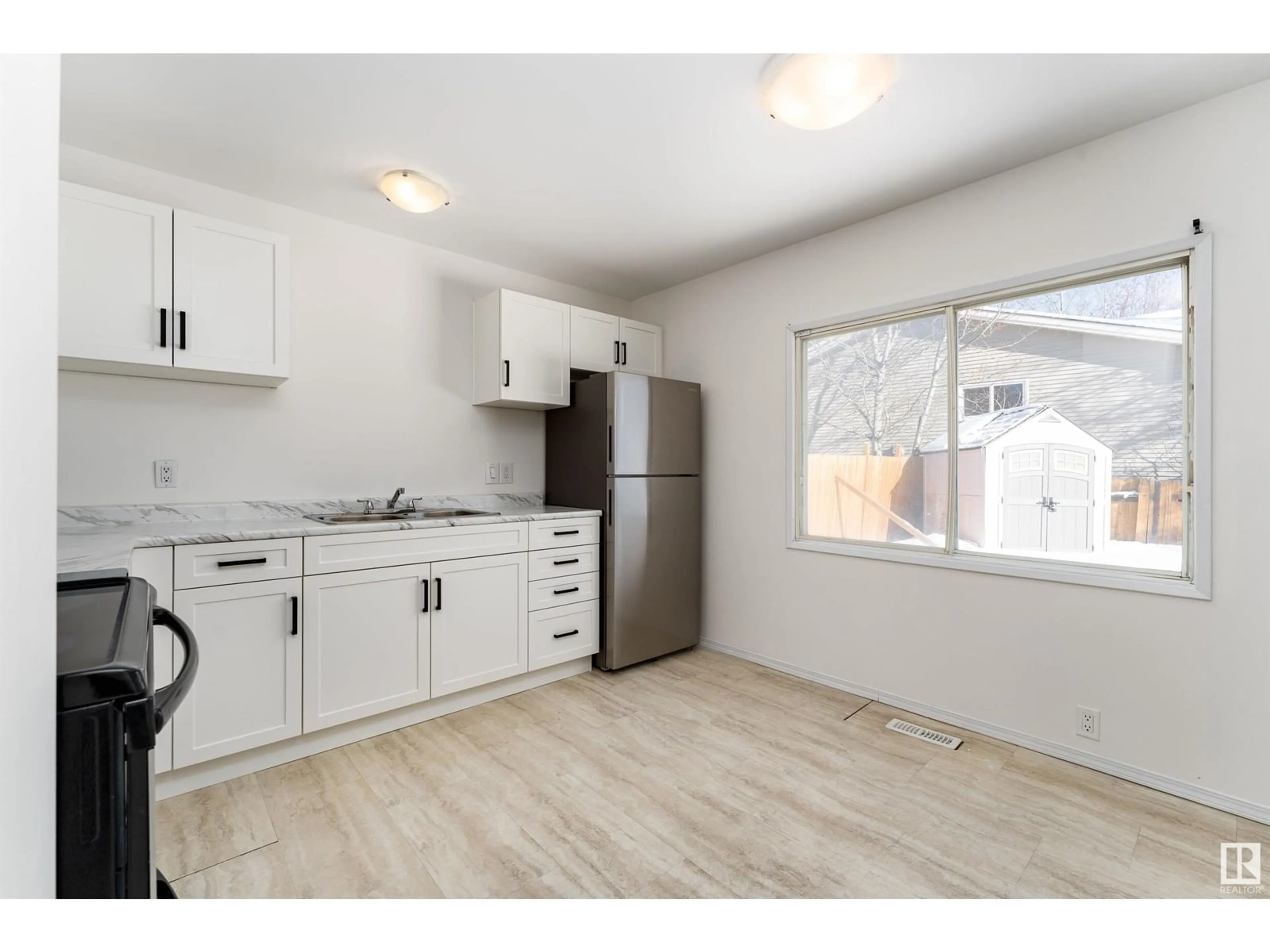 Standard kitchen, wood/laminate floor for 3307 46 ST NW, Edmonton Alberta T6L4R8