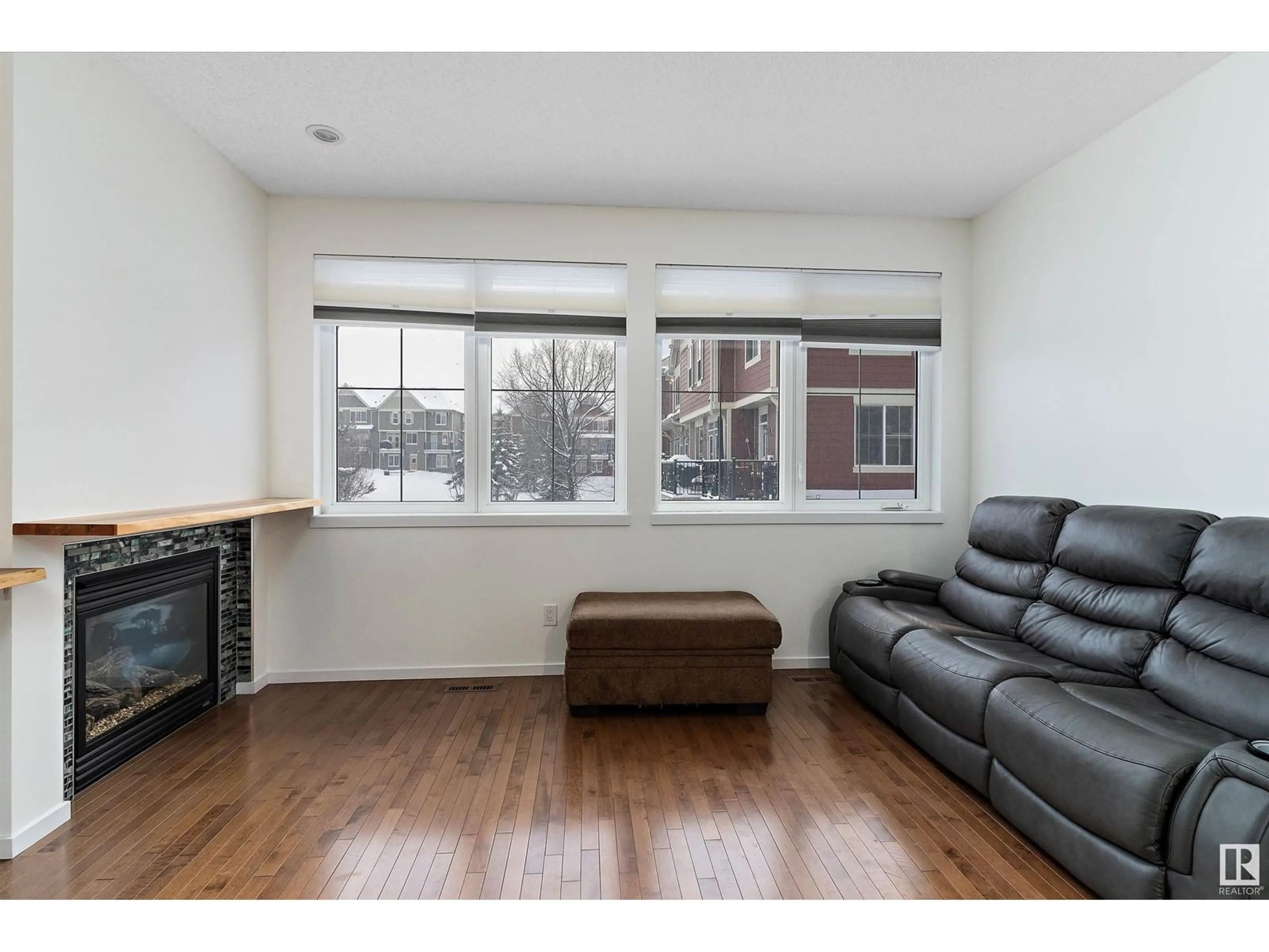 Living room with furniture, wood/laminate floor for #42 603 Watt BV SW, Edmonton Alberta T6X0P3