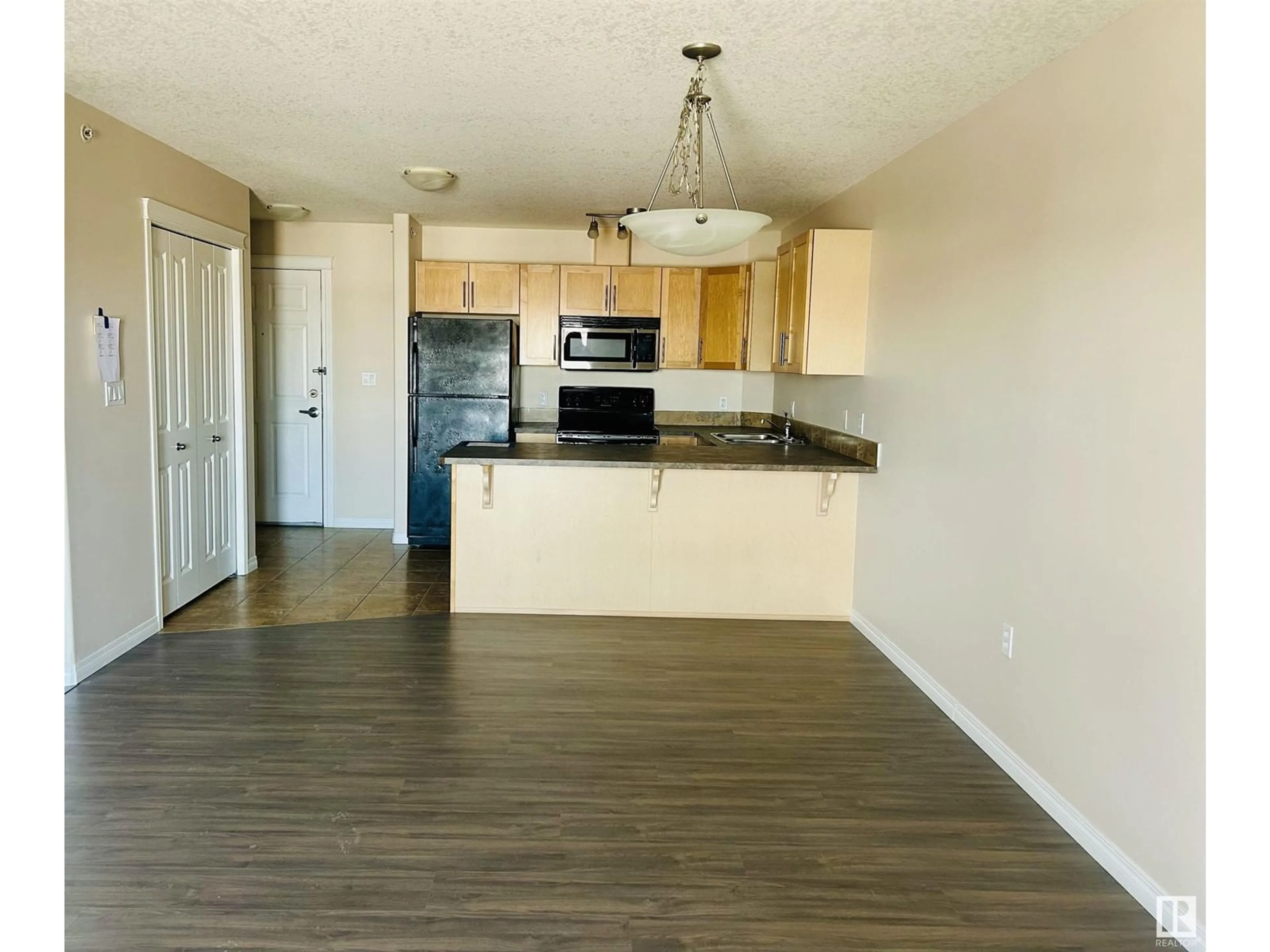 Open concept kitchen, wood/laminate floor for #420 300 SPRUCE RIDGE RD, Spruce Grove Alberta T7X0H6