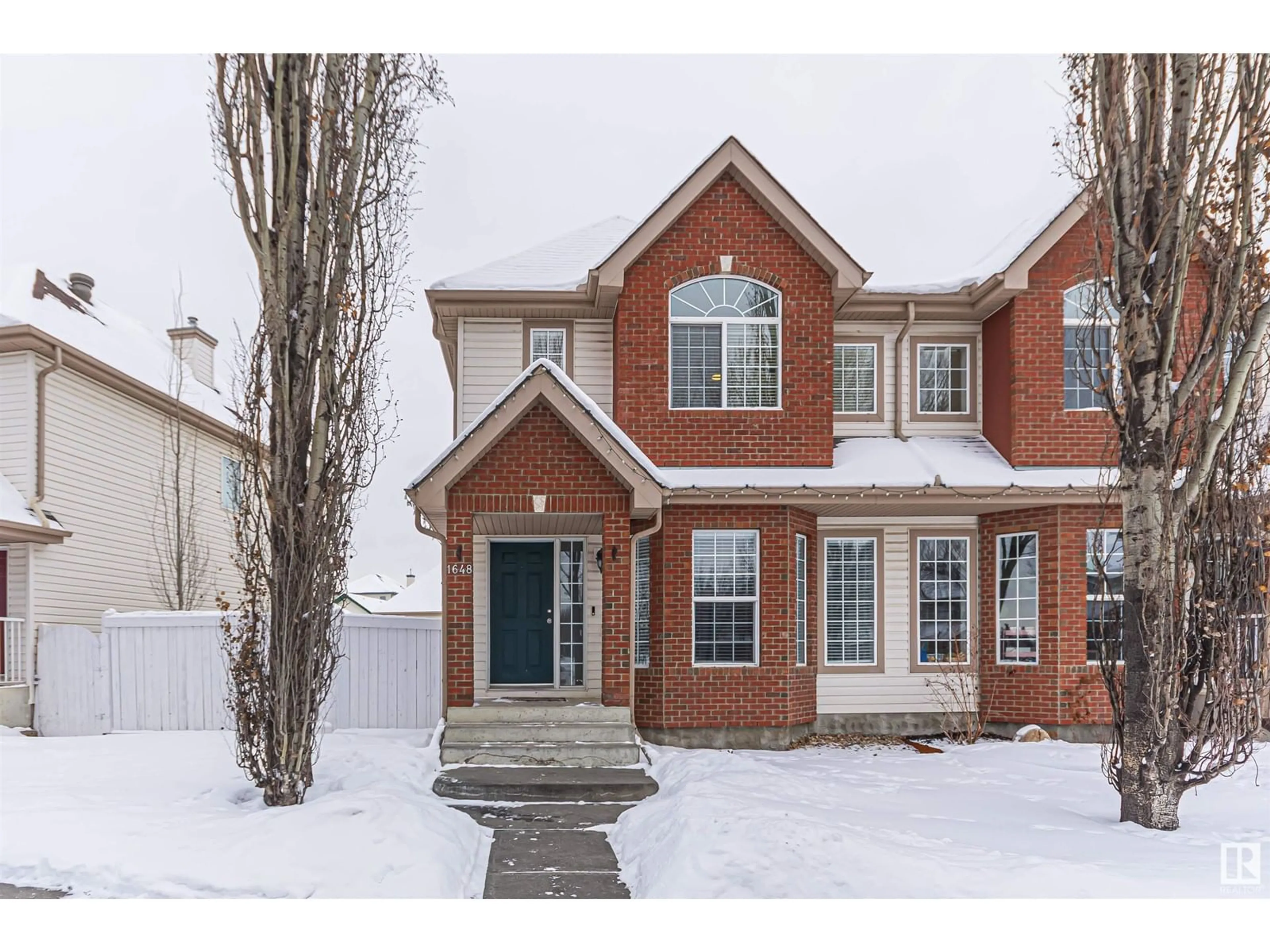 Home with brick exterior material, street for 1648 TOMLINSON CM NW, Edmonton Alberta T6R2Y7