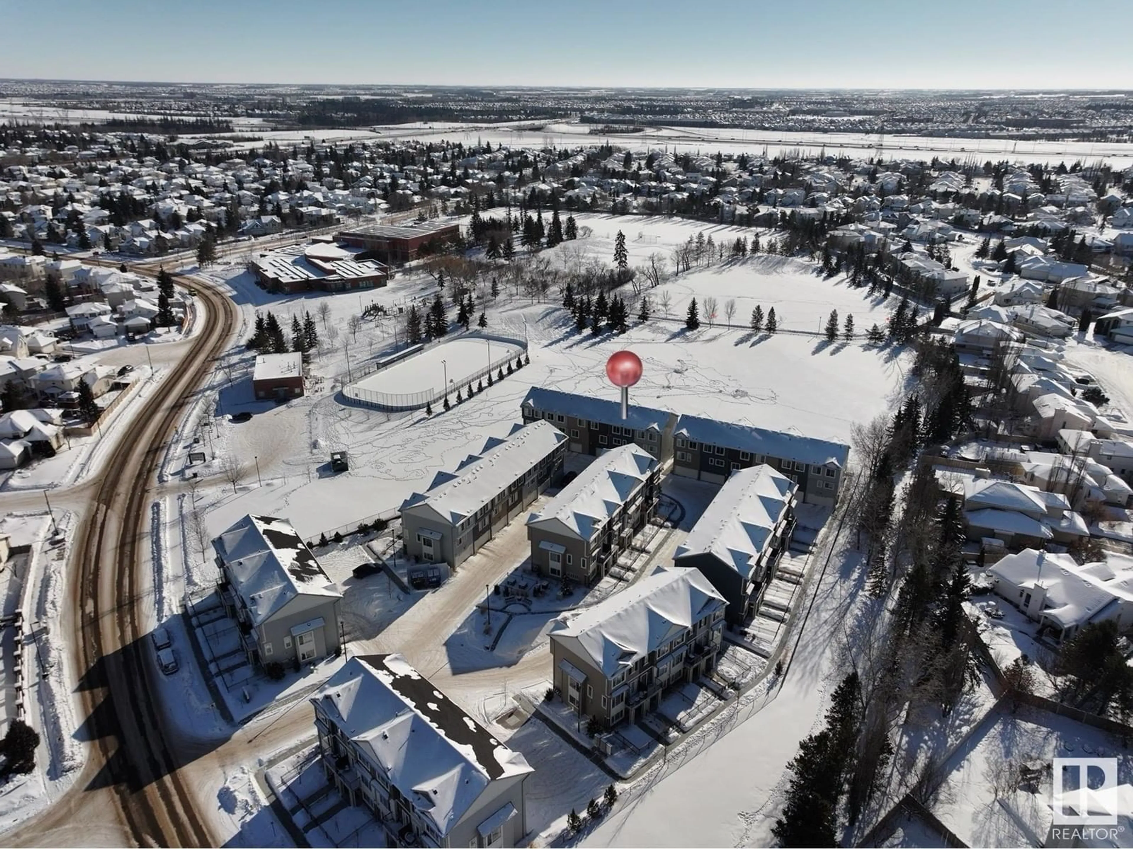 A pic from outside/outdoor area/front of a property/back of a property/a pic from drone, unknown for #12 11373 12 AV NW, Edmonton Alberta T6J5V2