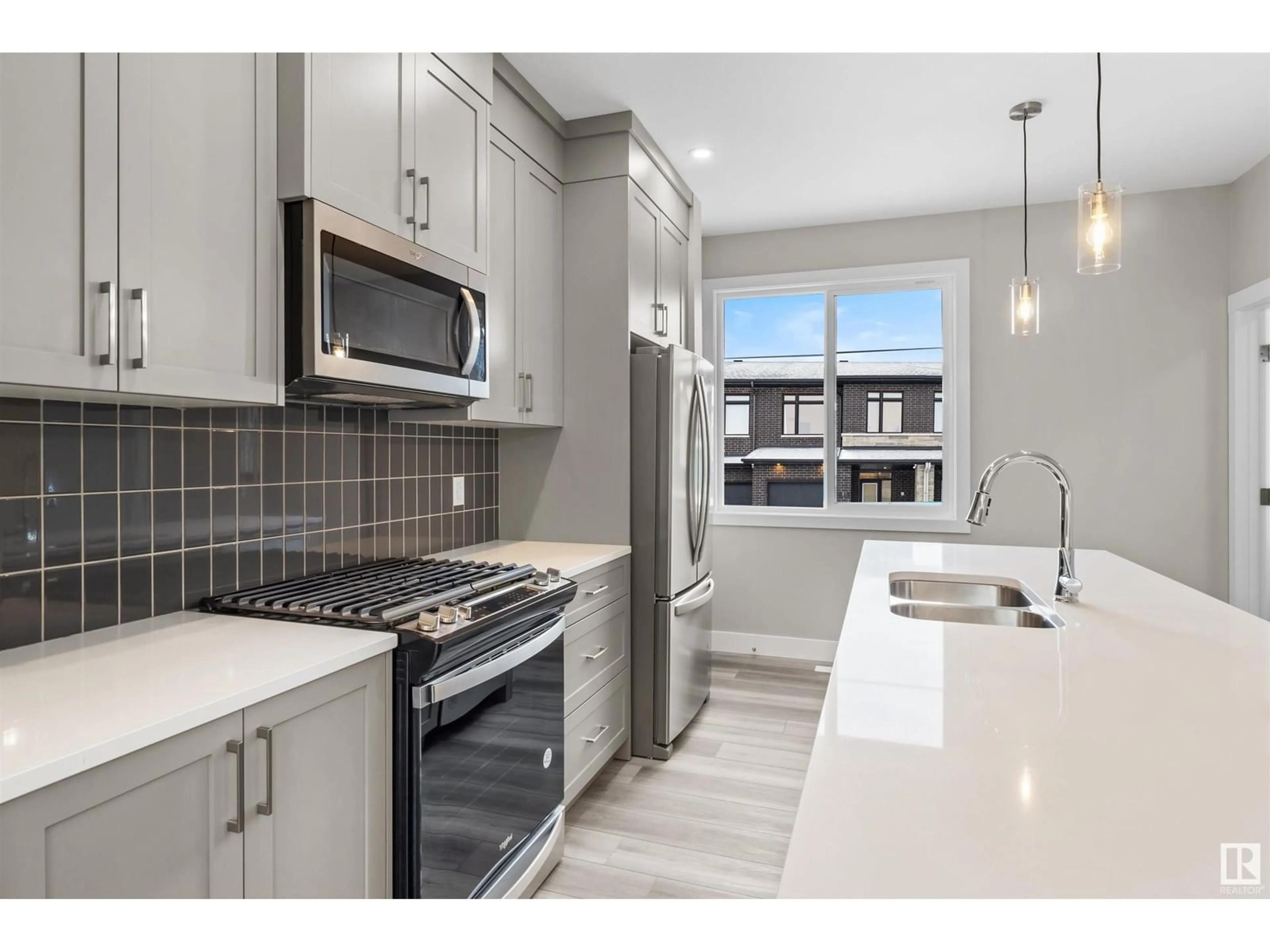 Open concept kitchen, ceramic/tile floor for #63 6905 25 AV SW, Edmonton Alberta T6X3B7