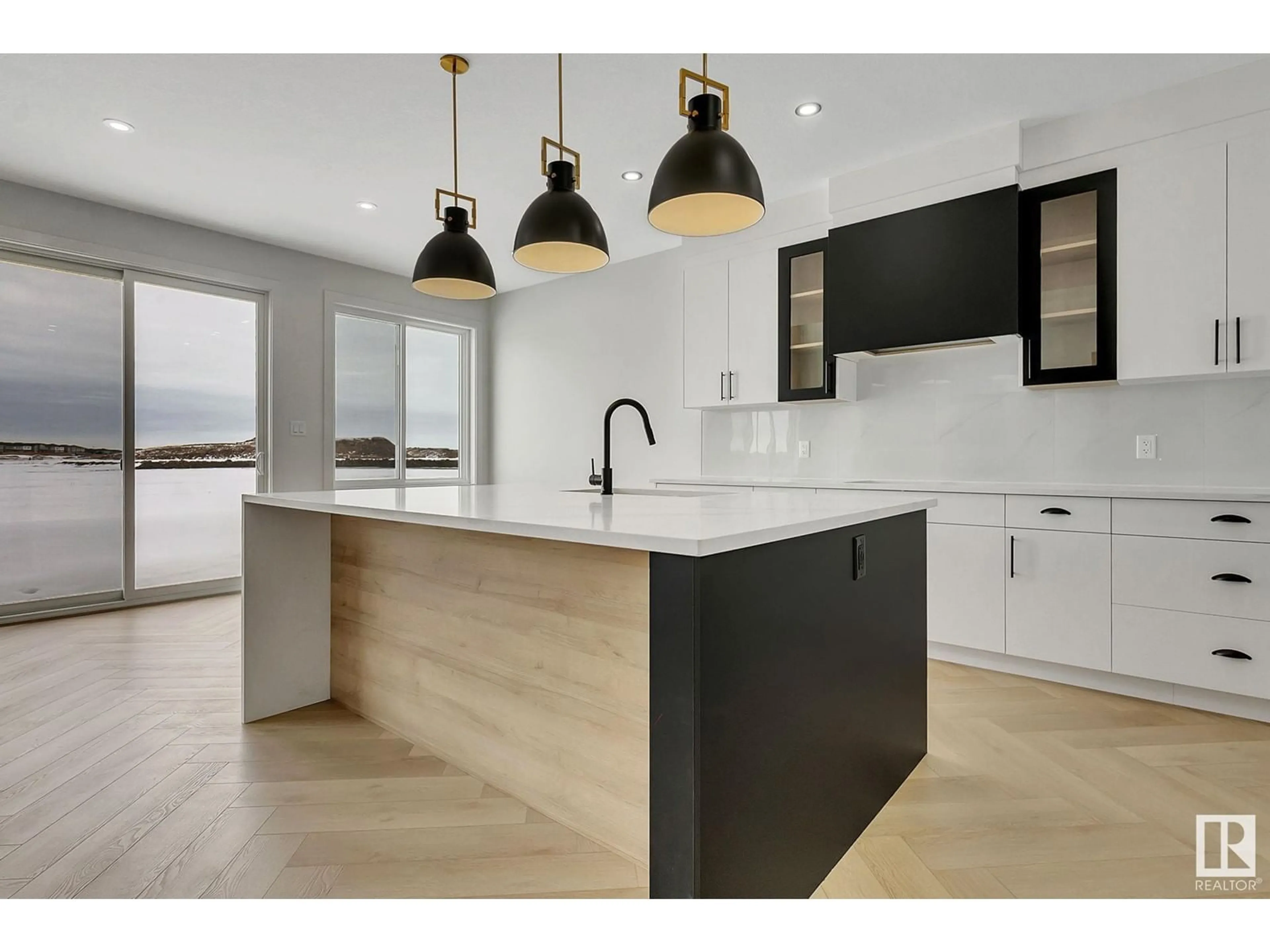 Open concept kitchen, wood/laminate floor for SW - 5803 KOOTOOK LI, Edmonton Alberta T6W4Z6