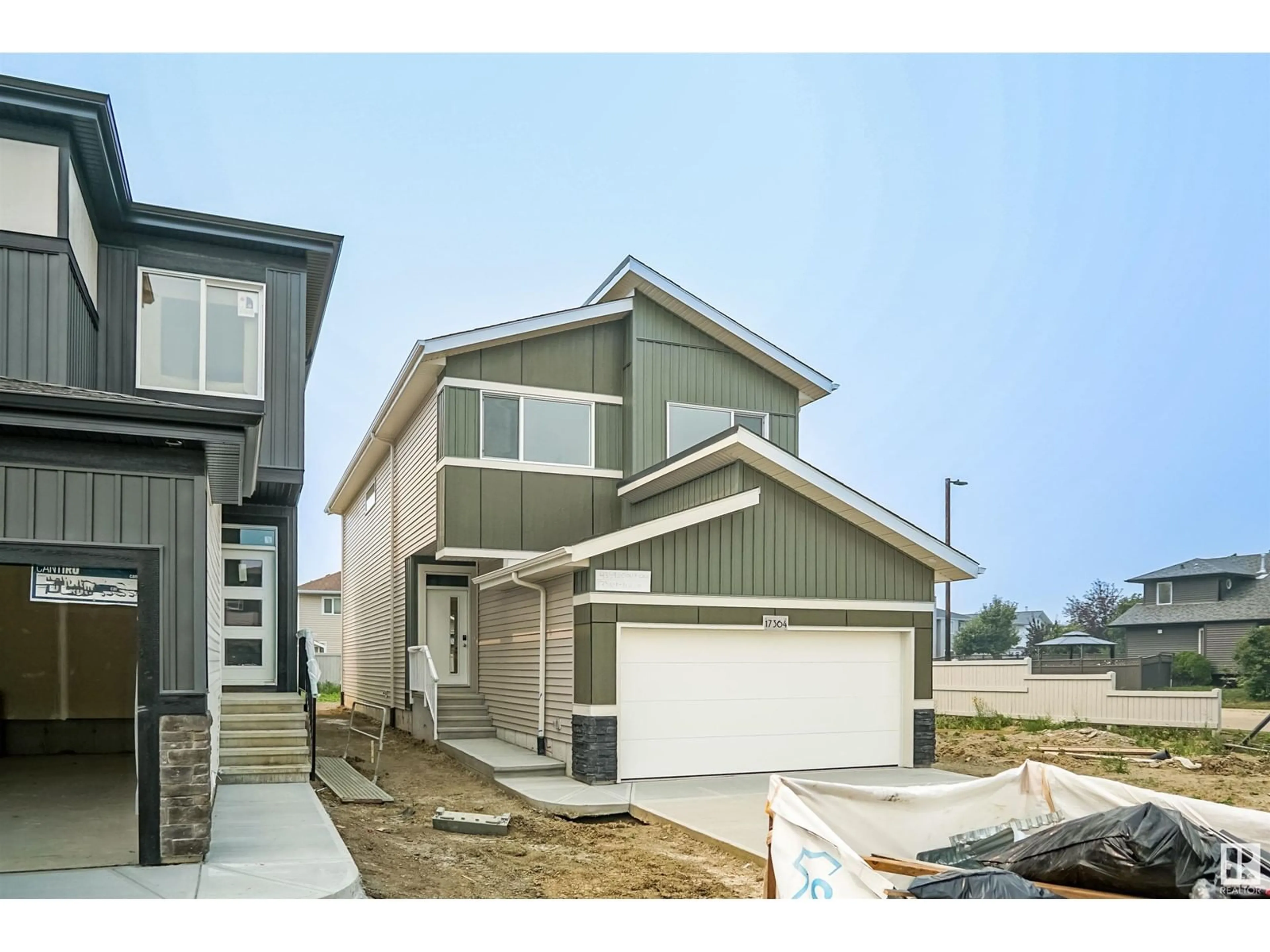 Home with vinyl exterior material, street for 17363 99 ST NW, Edmonton Alberta T5X0M5