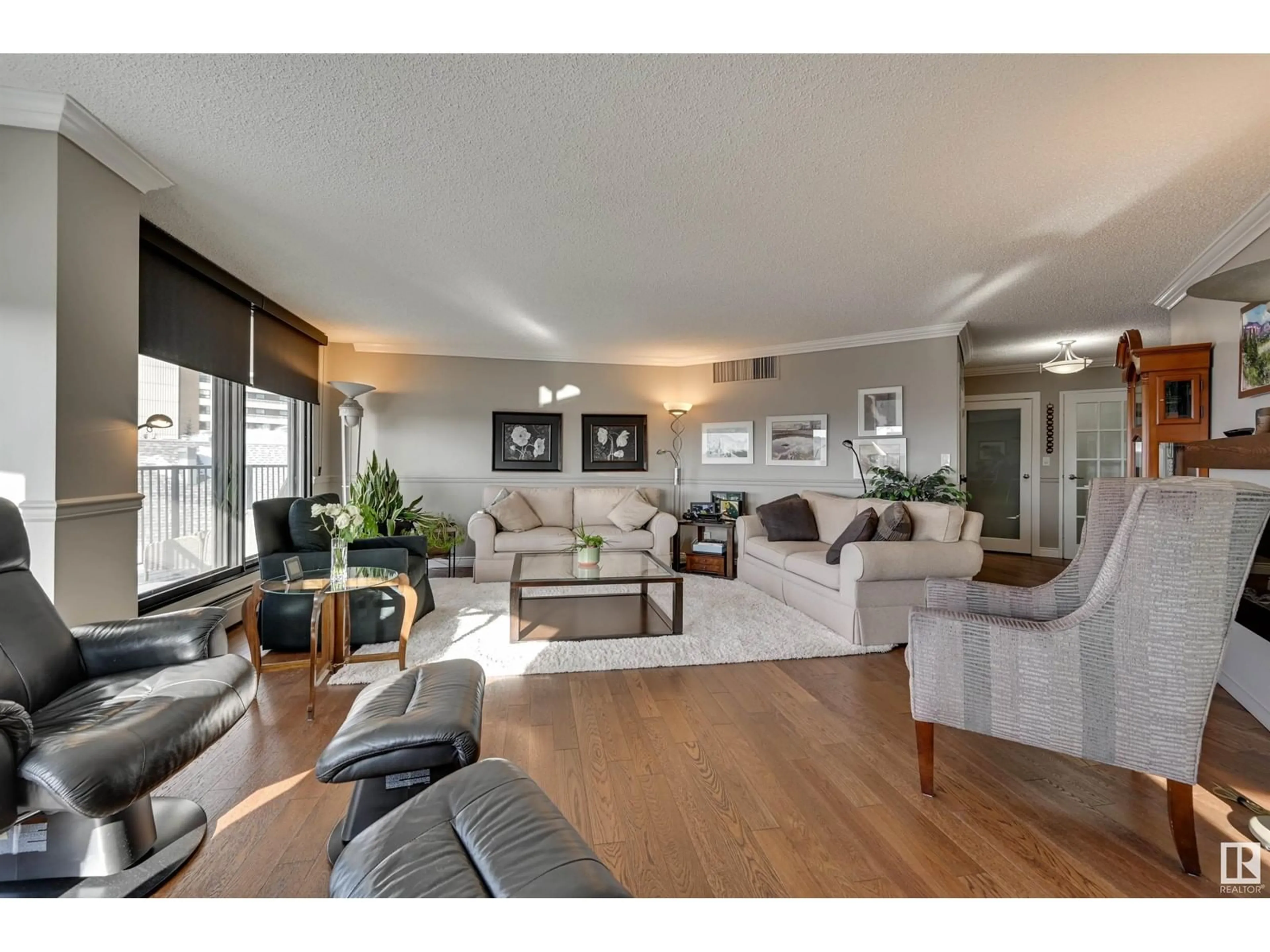 Living room with furniture, wood/laminate floor for #703 11710 100 AV NW, Edmonton Alberta T5K2G3