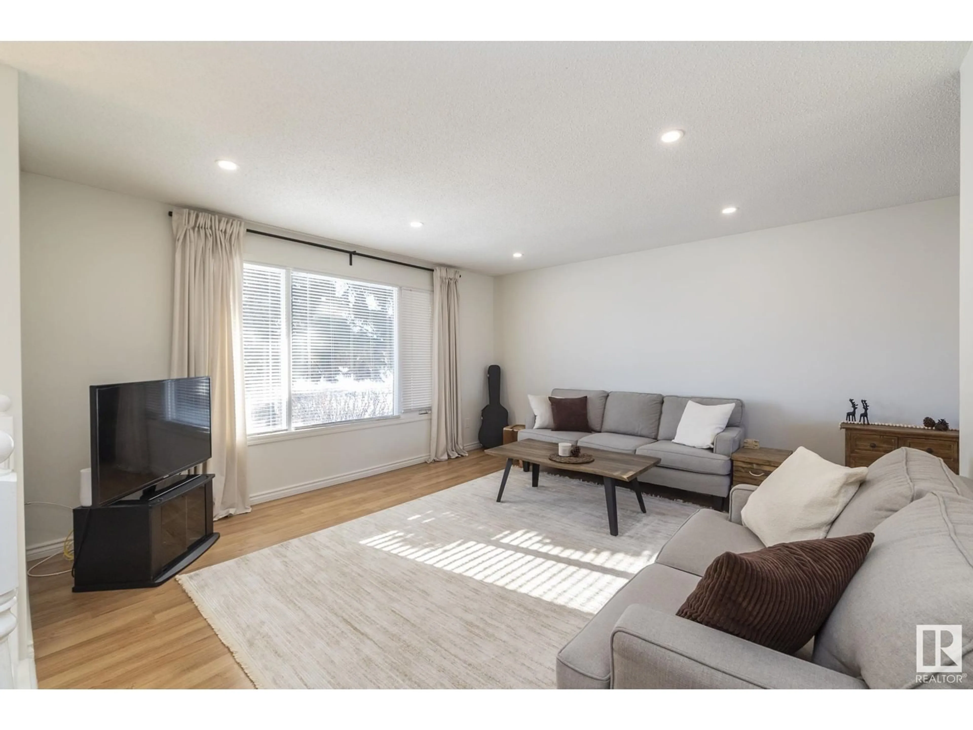 Living room with furniture, wood/laminate floor for 4207 40 AV, Stony Plain Alberta T7Z1J8