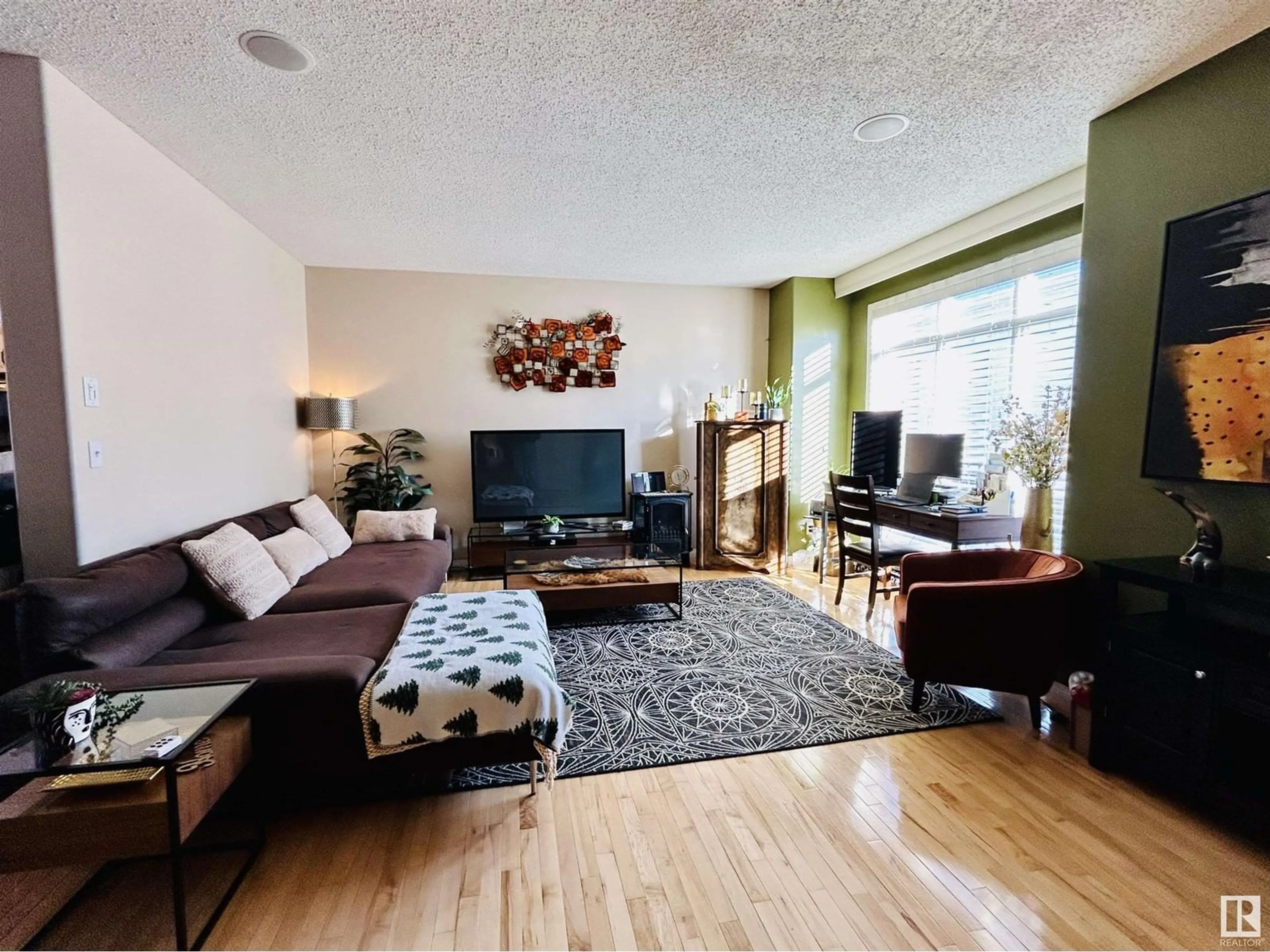 Living room with furniture, wood/laminate floor for #53 8403 164 AV NW, Edmonton Alberta T5Z3Y2