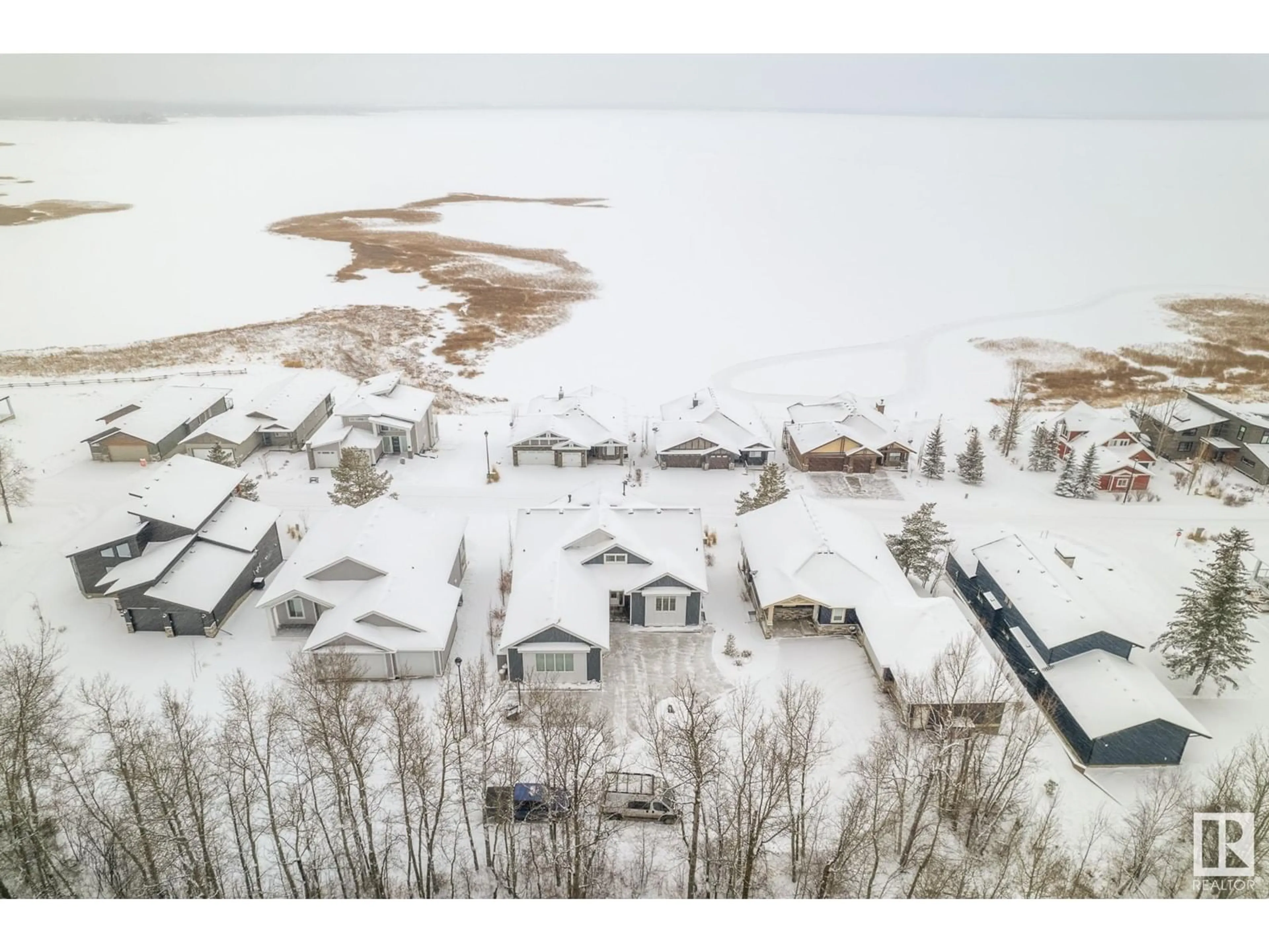 A pic from outside/outdoor area/front of a property/back of a property/a pic from drone, water/lake/river/ocean view for #105 55101 STE. ANNE TR, Rural Lac Ste. Anne County Alberta T0E1A1