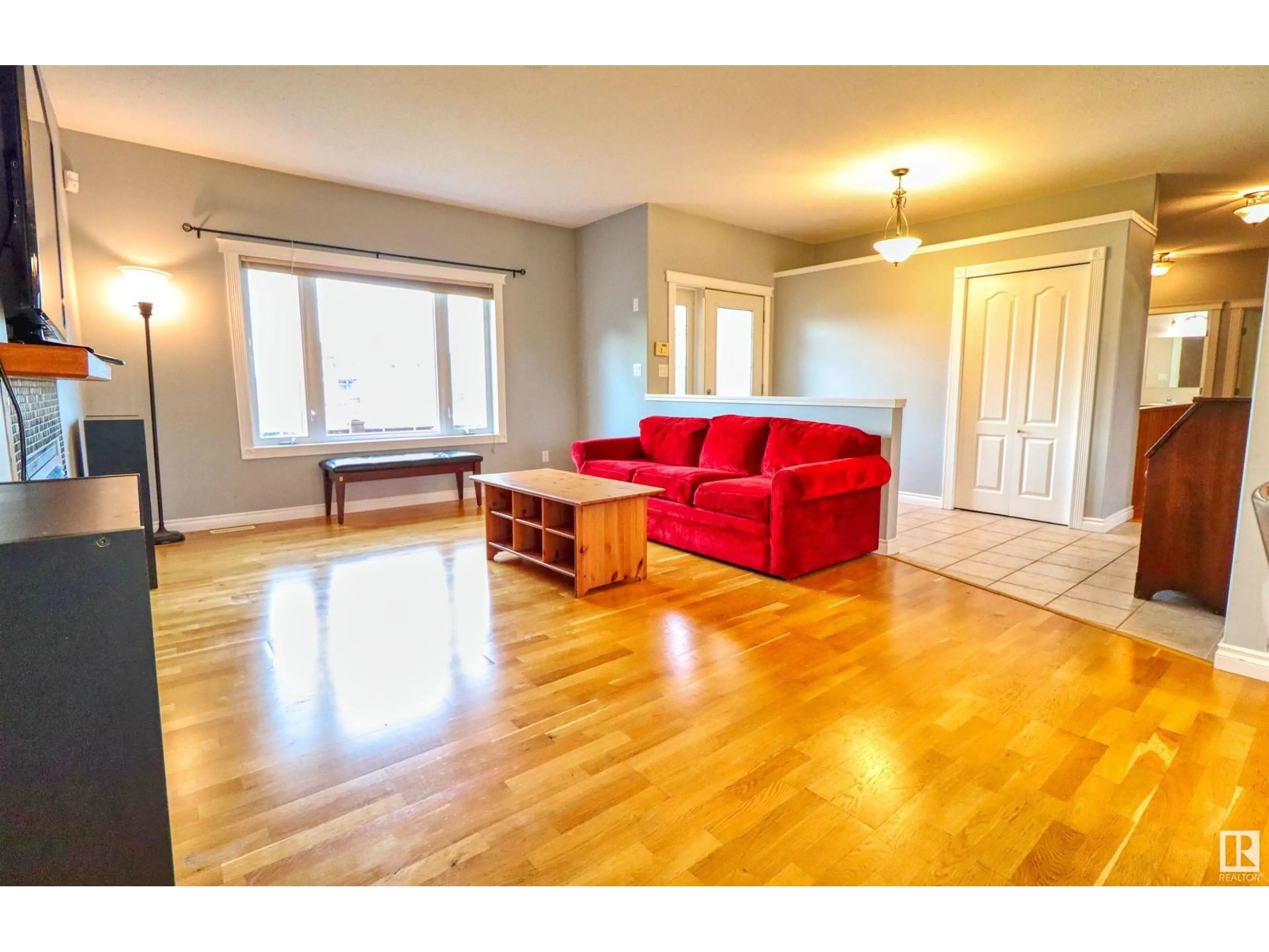 Living room with furniture, wood/laminate floor for 5209 Drake DR, Cold Lake Alberta T9M1N9