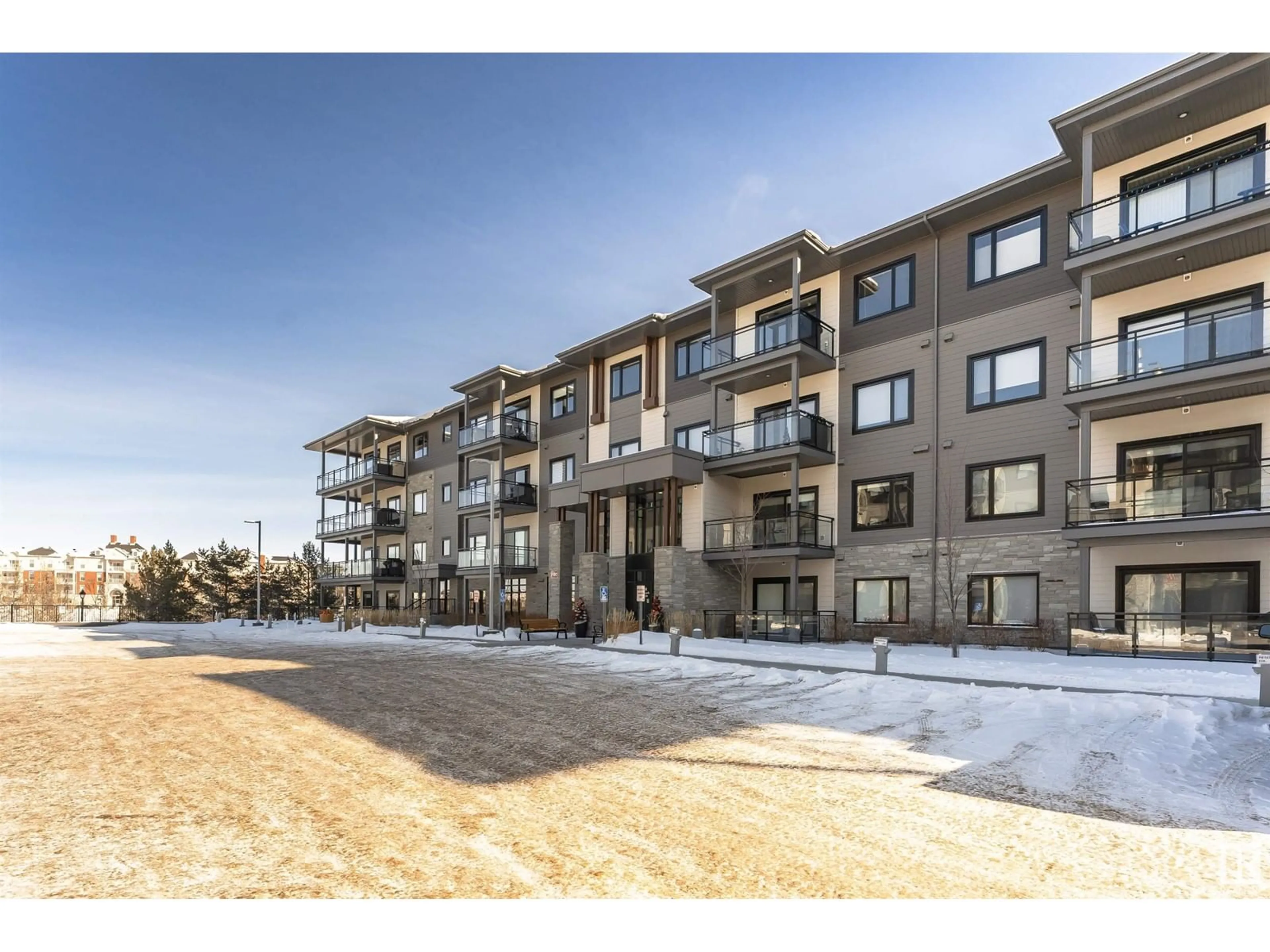 A pic from outside/outdoor area/front of a property/back of a property/a pic from drone, building for #427 524 GRIESBACH PR NW, Edmonton Alberta T5E6X2