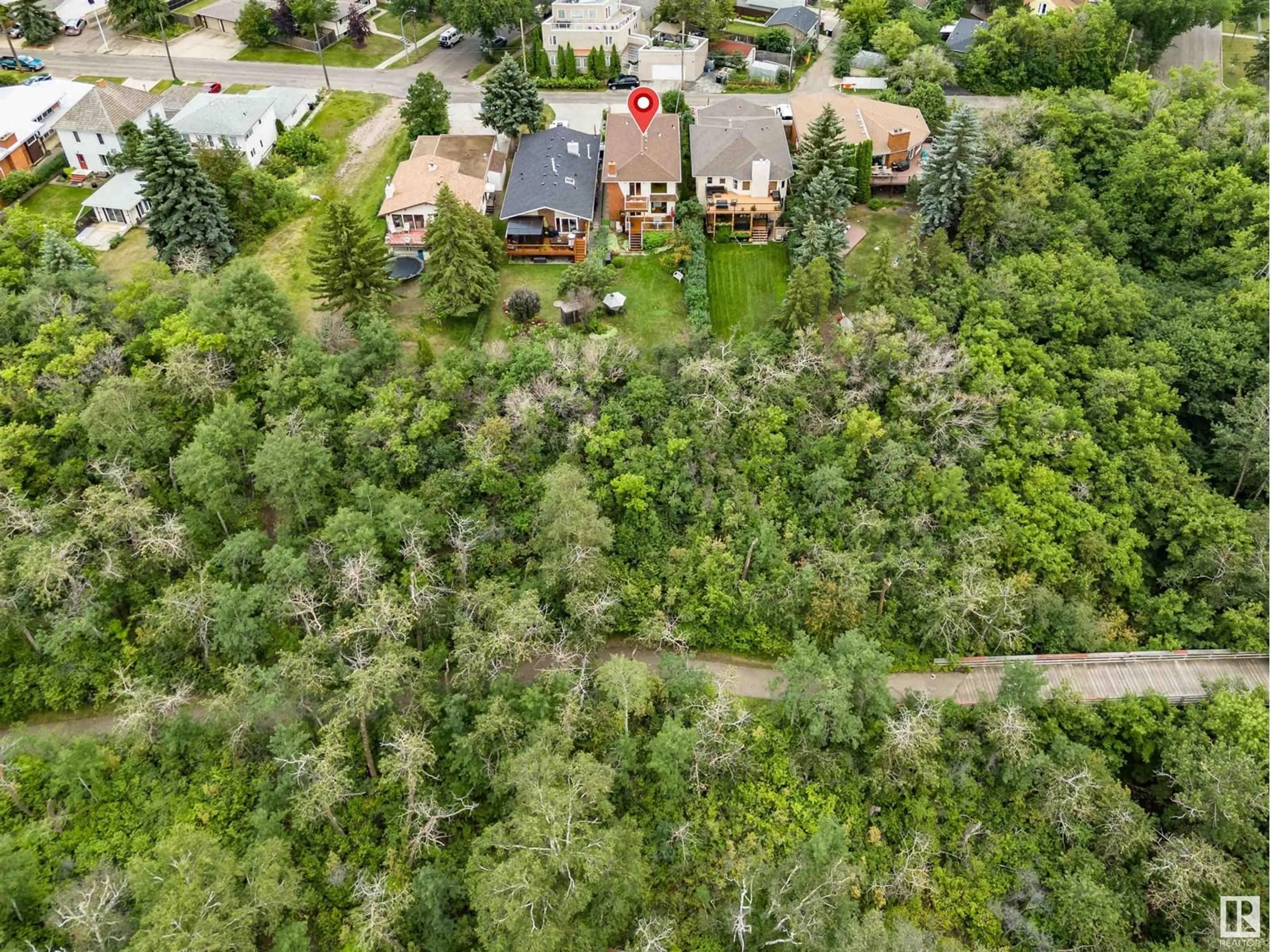 A pic from outside/outdoor area/front of a property/back of a property/a pic from drone, forest/trees view for 8212 Rowland RD NW, Edmonton Alberta T6A3W9