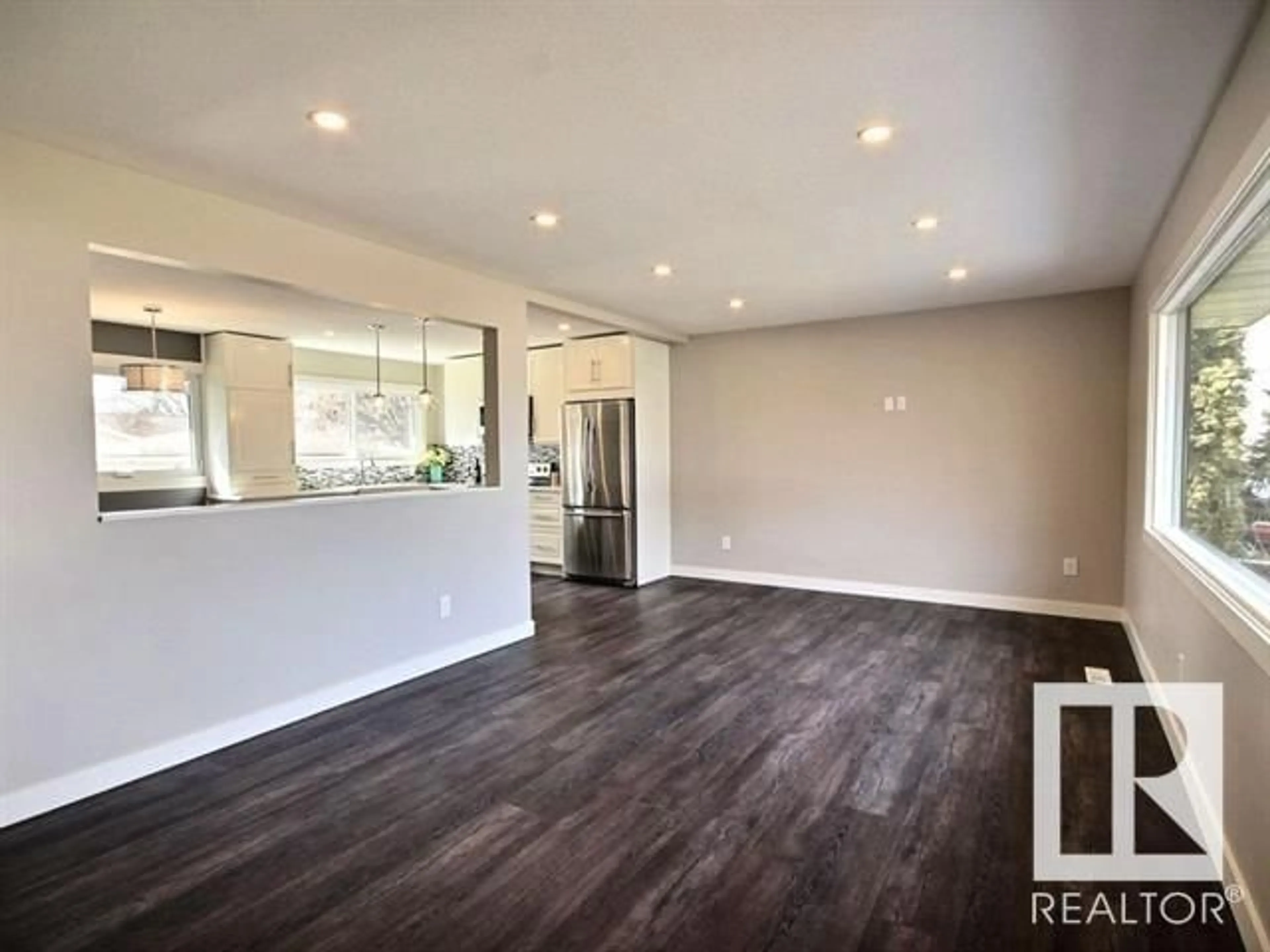 Open concept kitchen, wood/laminate floor for 15921 93A AV NW, Edmonton Alberta T5R5J5