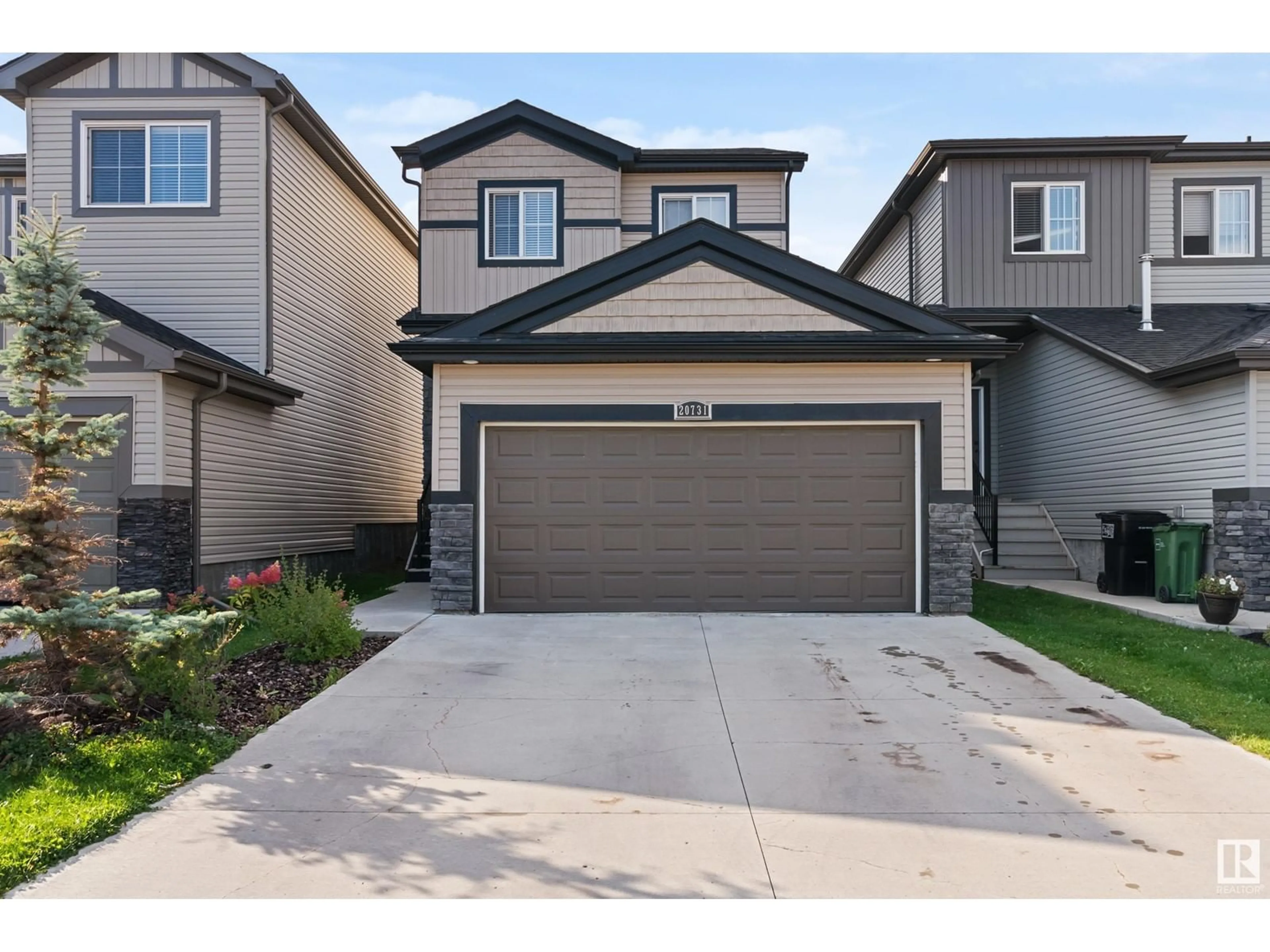 Home with vinyl exterior material, street for 20731 99 AV NW NW, Edmonton Alberta T5T7G3