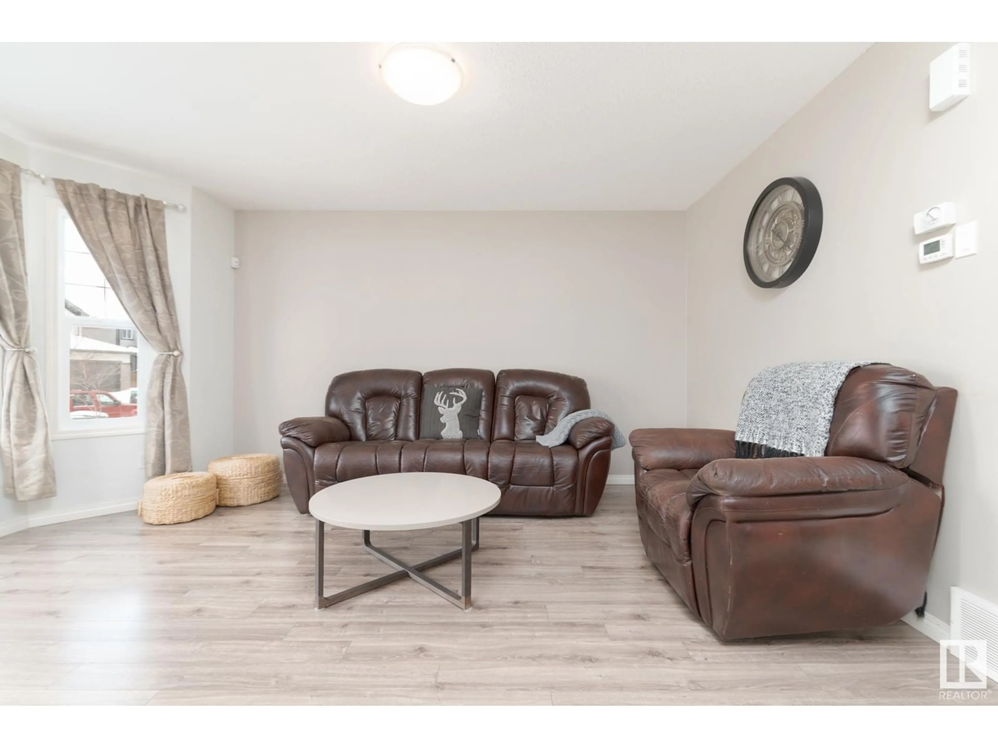 Living room with furniture, wood/laminate floor for 3 HEWITT CI, Spruce Grove Alberta T7X0K6