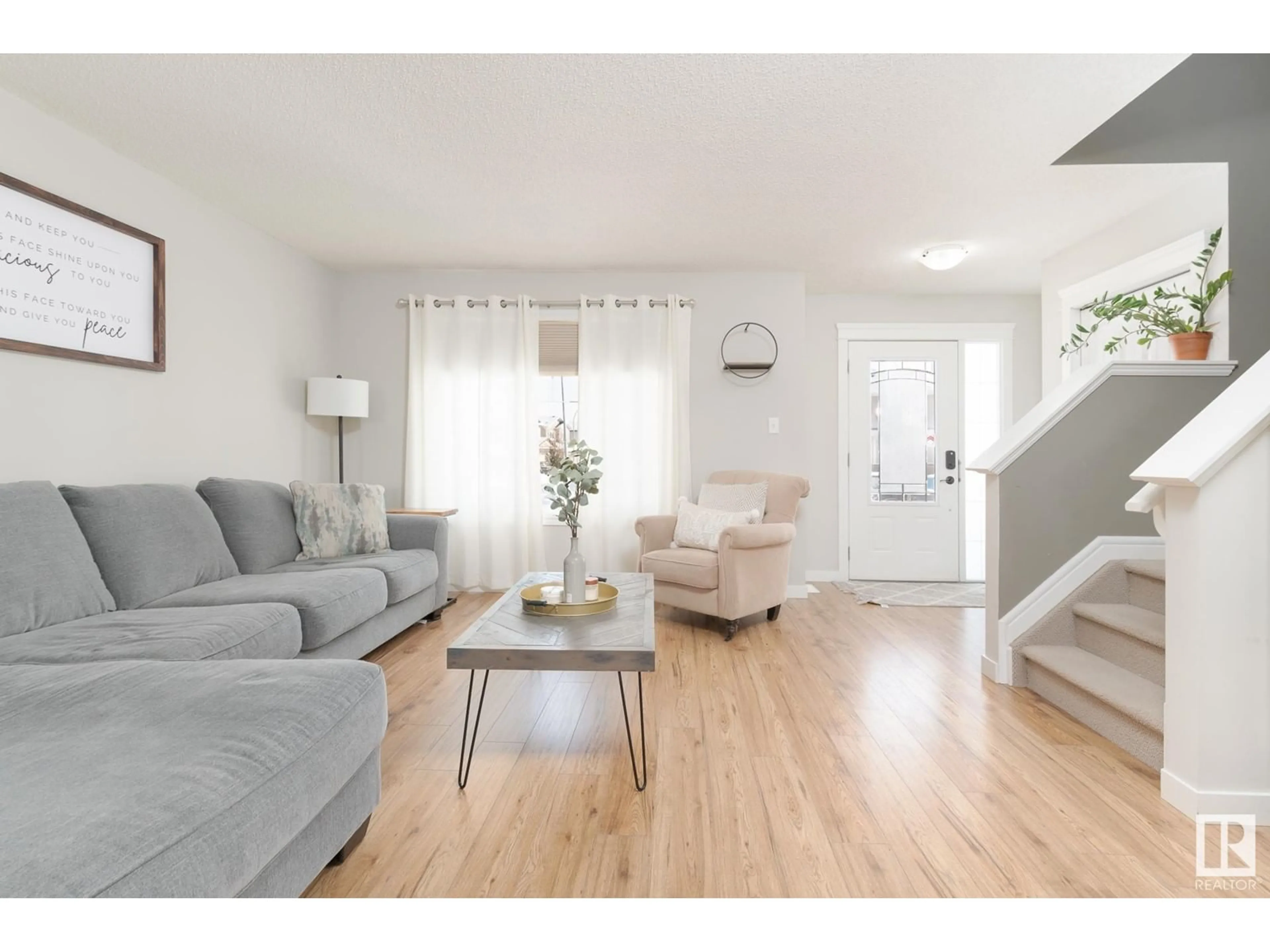 Living room with furniture, wood/laminate floor for 97 HARVEST RIDGE DR, Spruce Grove Alberta T7X0R9