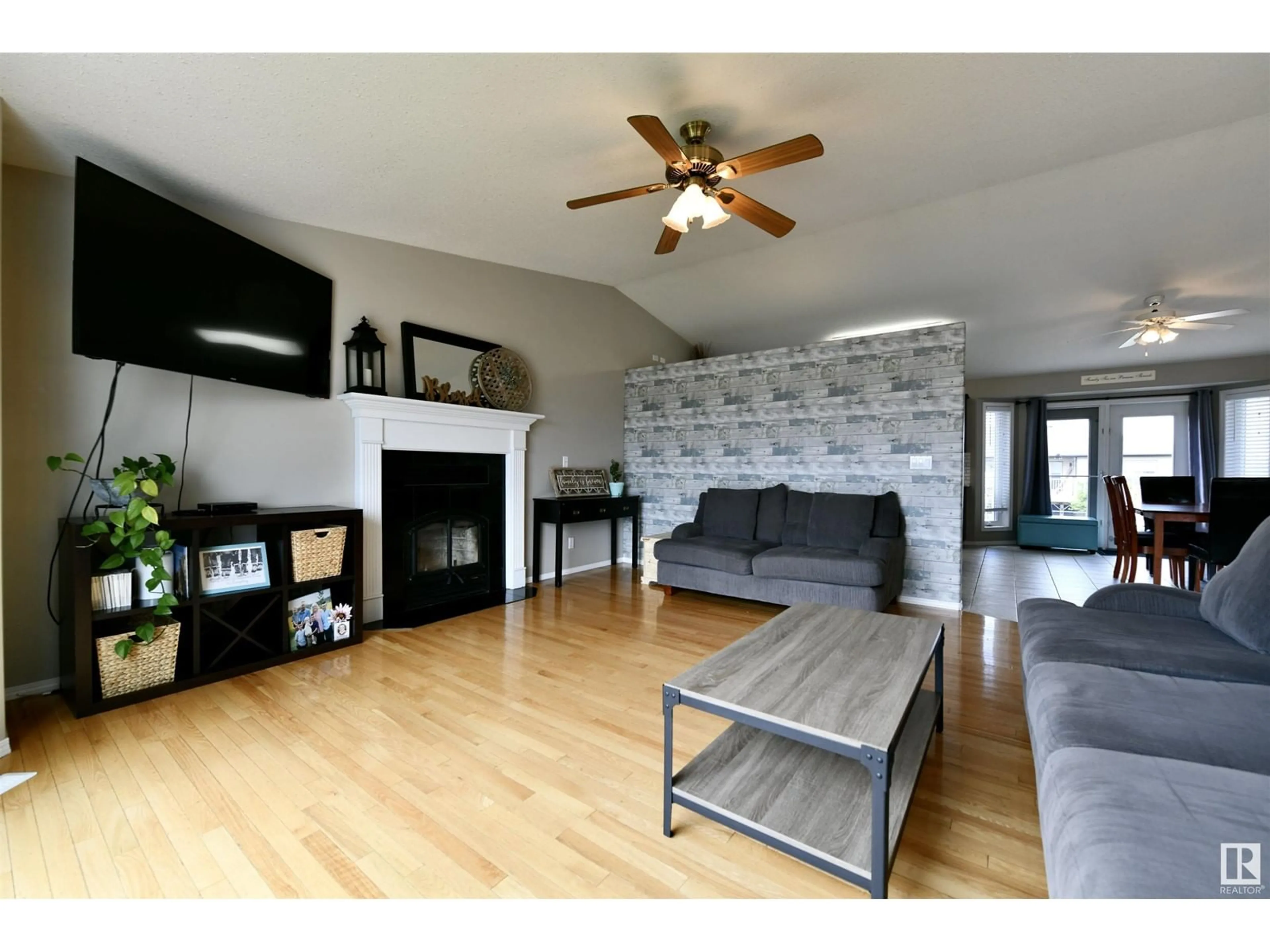 Living room with furniture, wood/laminate floor for 5914 47 AV, St. Paul Town Alberta T0A3A1