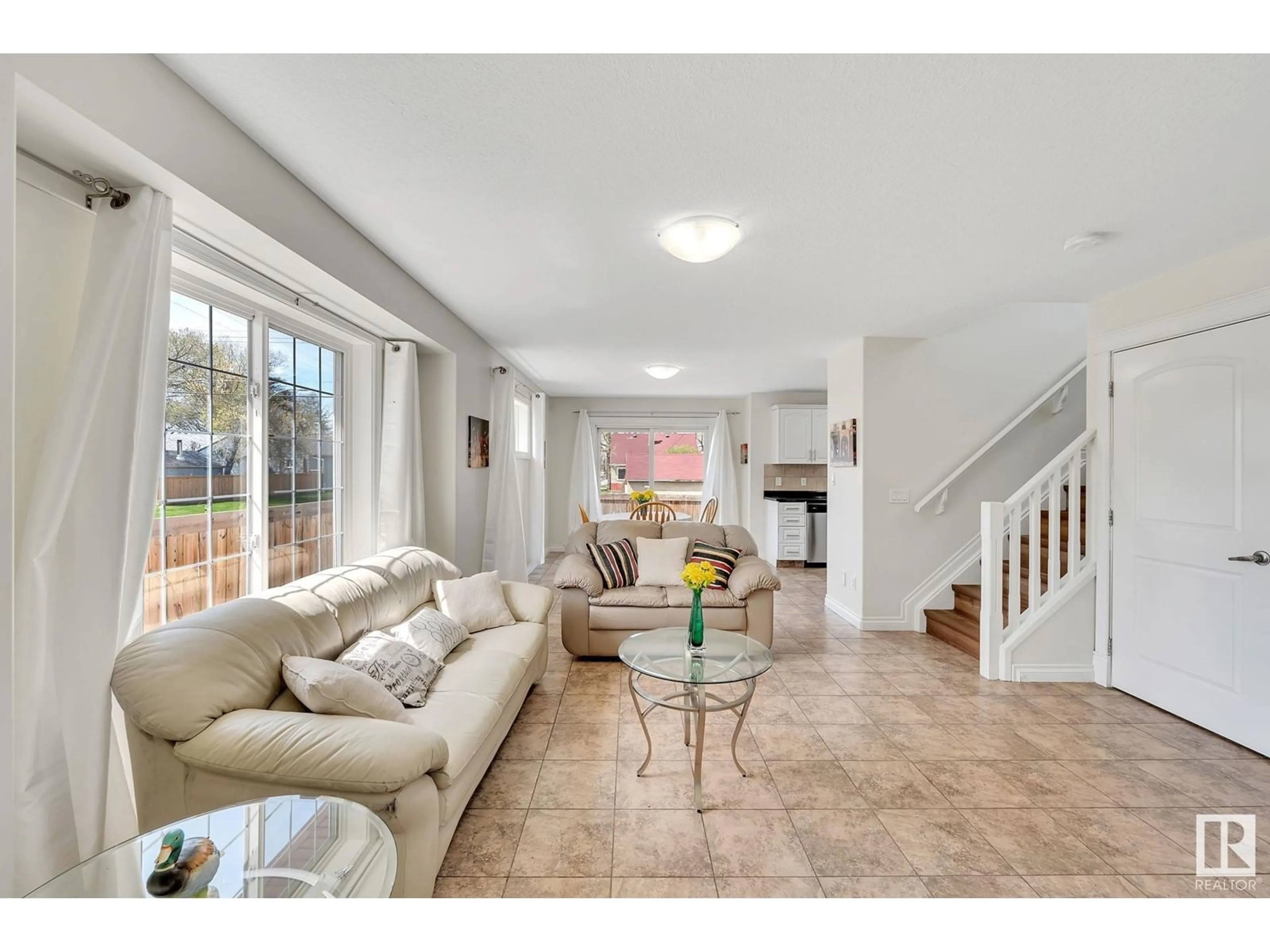 Living room with furniture, ceramic/tile floor for 7006 119 AV NW, Edmonton Alberta T5B1T7