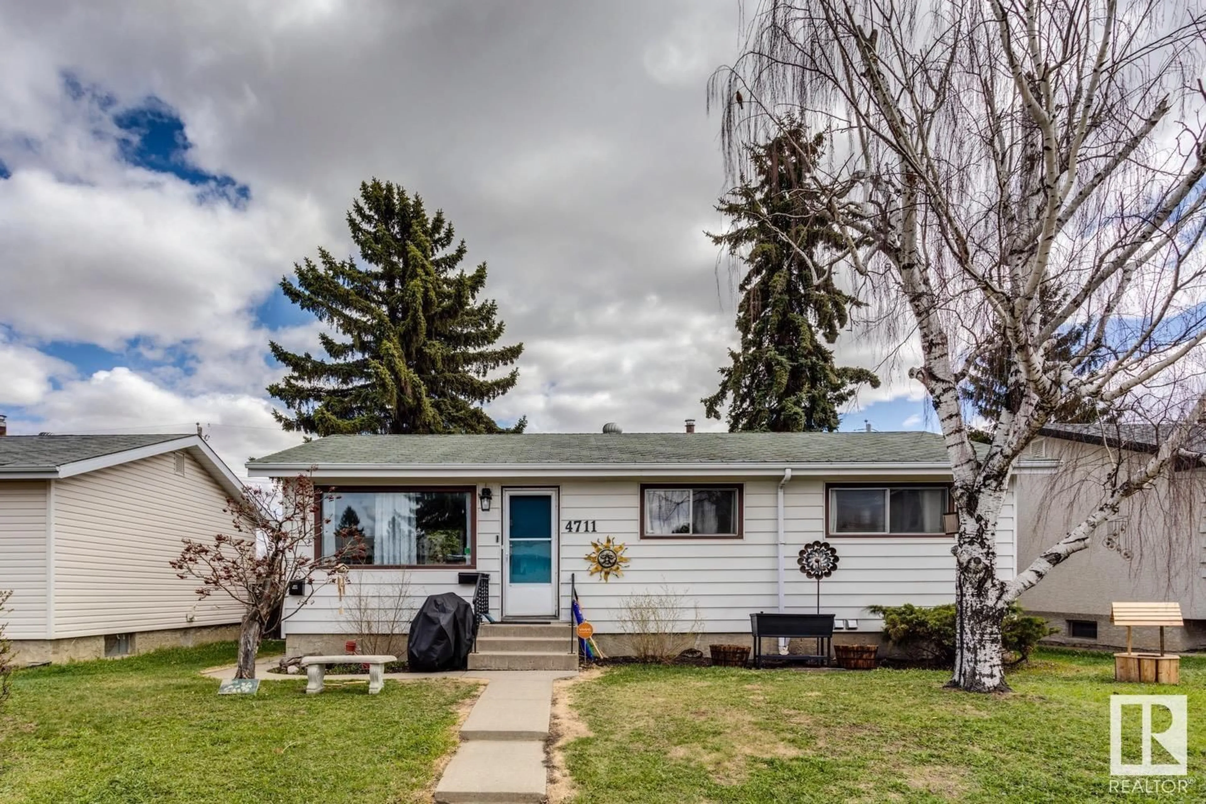 Home with vinyl exterior material, street for 4711 105A ST NW, Edmonton Alberta T6H2P2