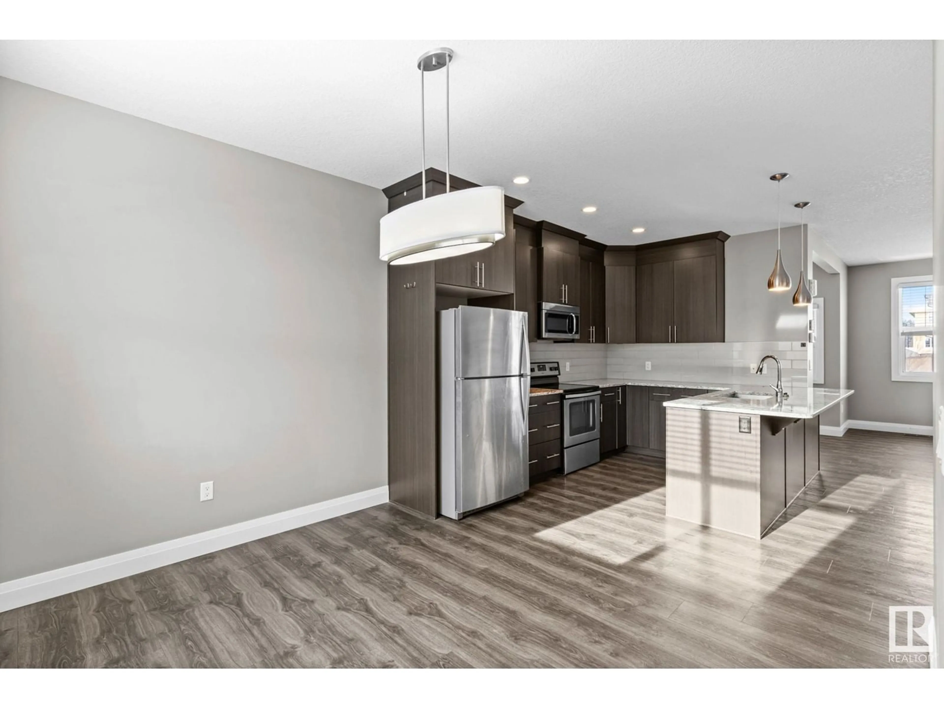 Open concept kitchen, wood/laminate floor for 140 HARVEST RIDGE DR NW, Spruce Grove Alberta T7X0E9