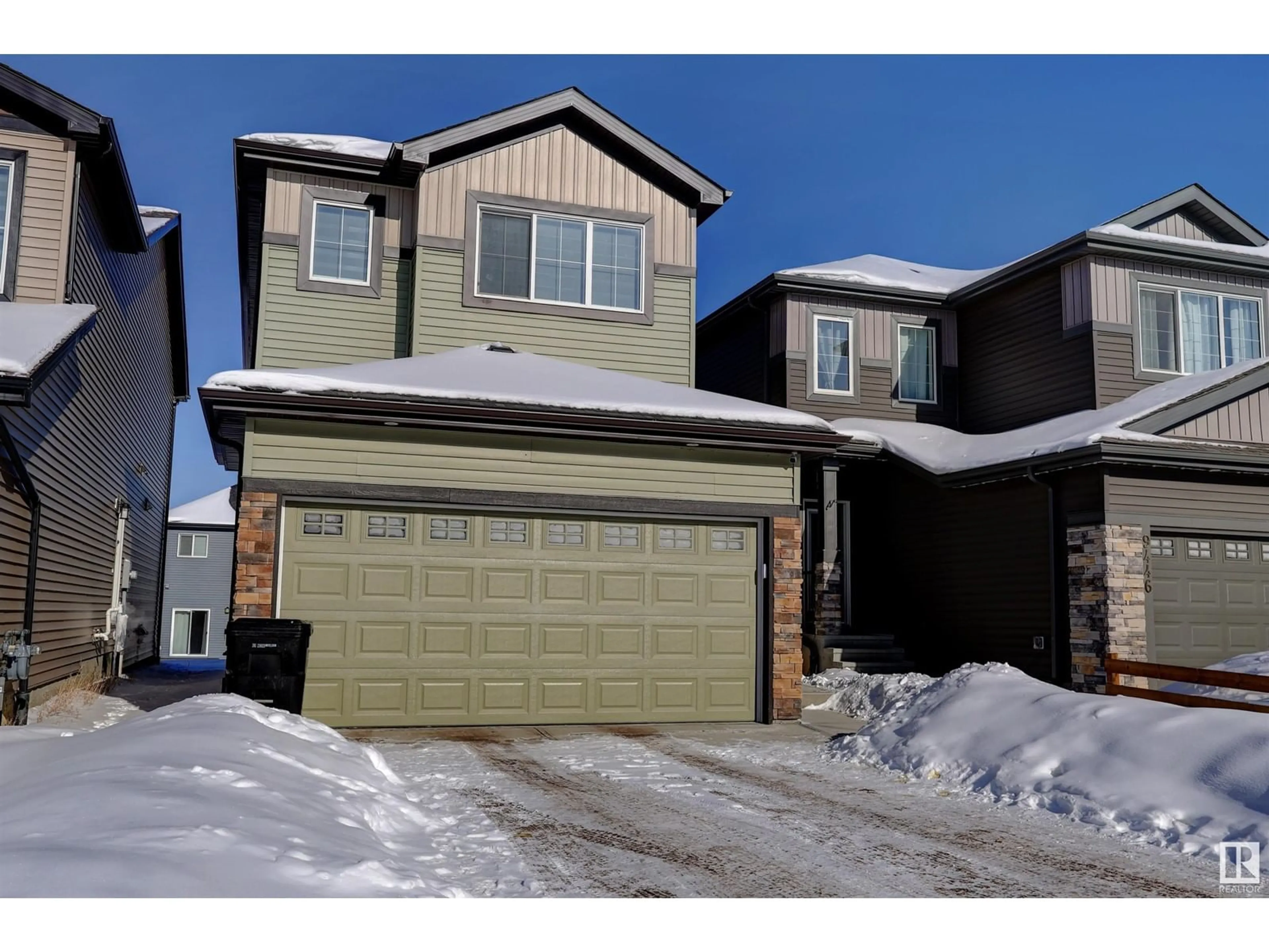 Home with vinyl exterior material, street for 9448 PEAR CR SW SW, Edmonton Alberta T6X2Z5