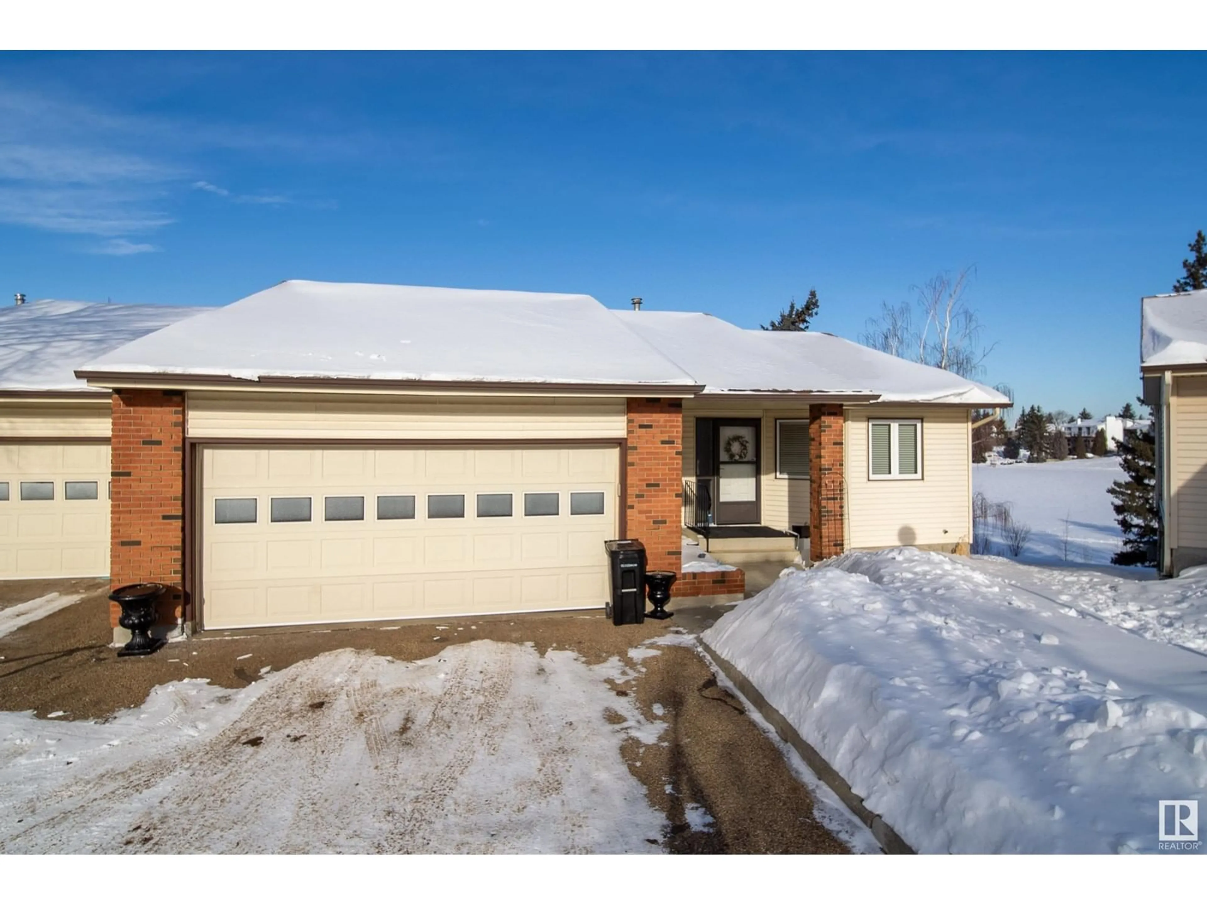 Home with brick exterior material, street for 10850 11 AV NW, Edmonton Alberta T6J6H9