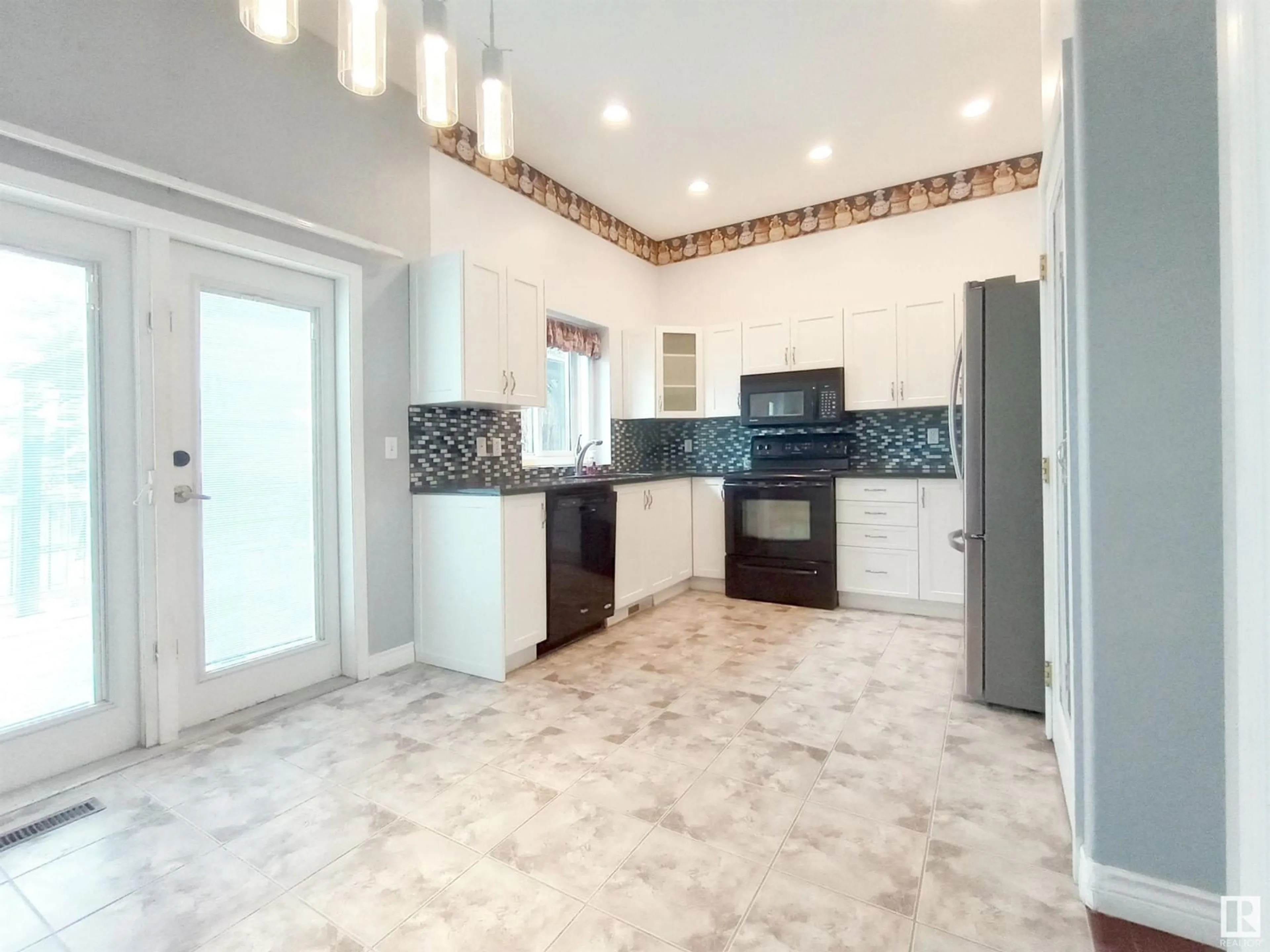 Open concept kitchen, ceramic/tile floor for 3524 40 AV NW, Edmonton Alberta T6L6M8