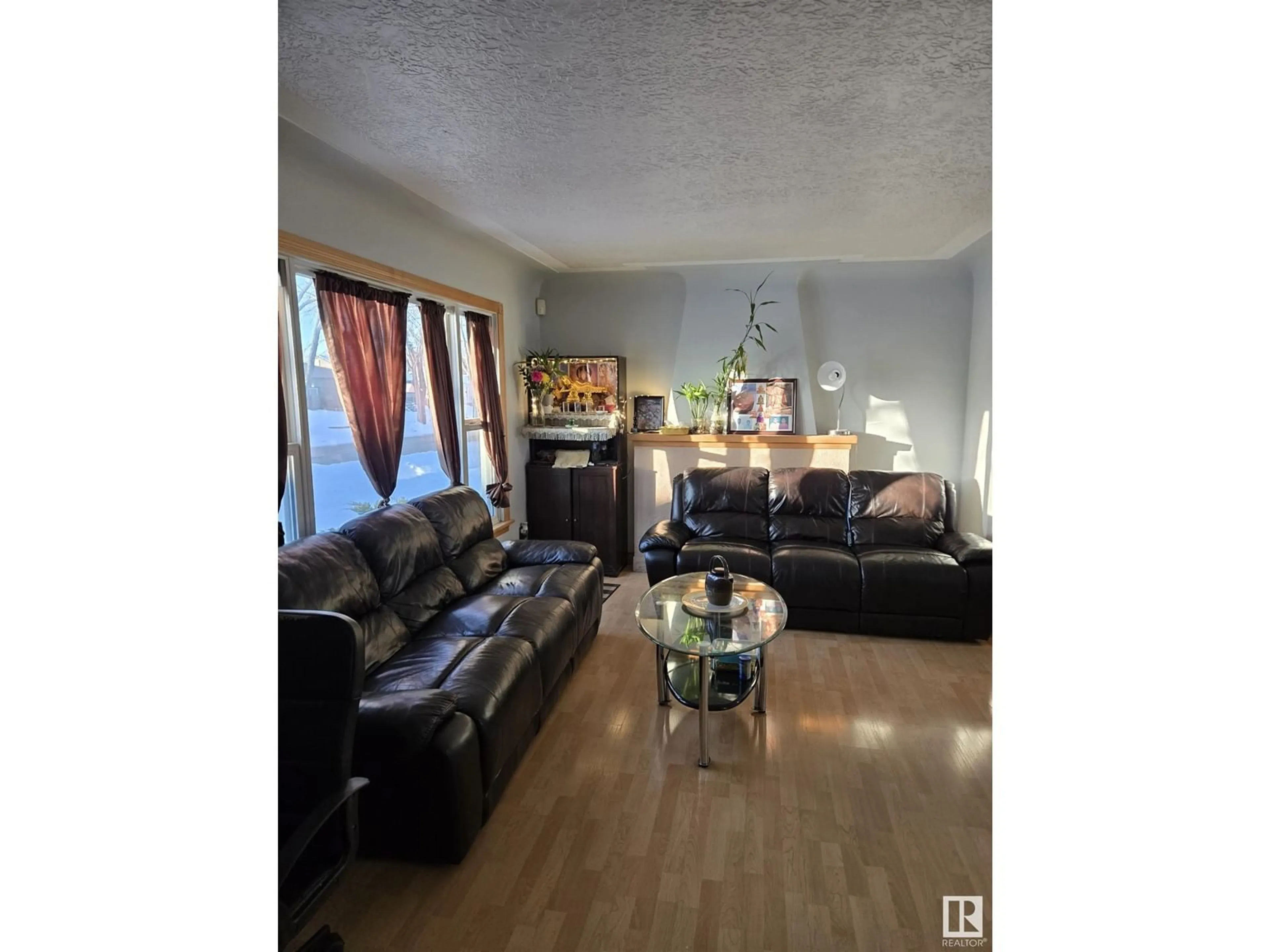 Living room with furniture, unknown for 10815 135 ST NW NW, Edmonton Alberta T5M1J8