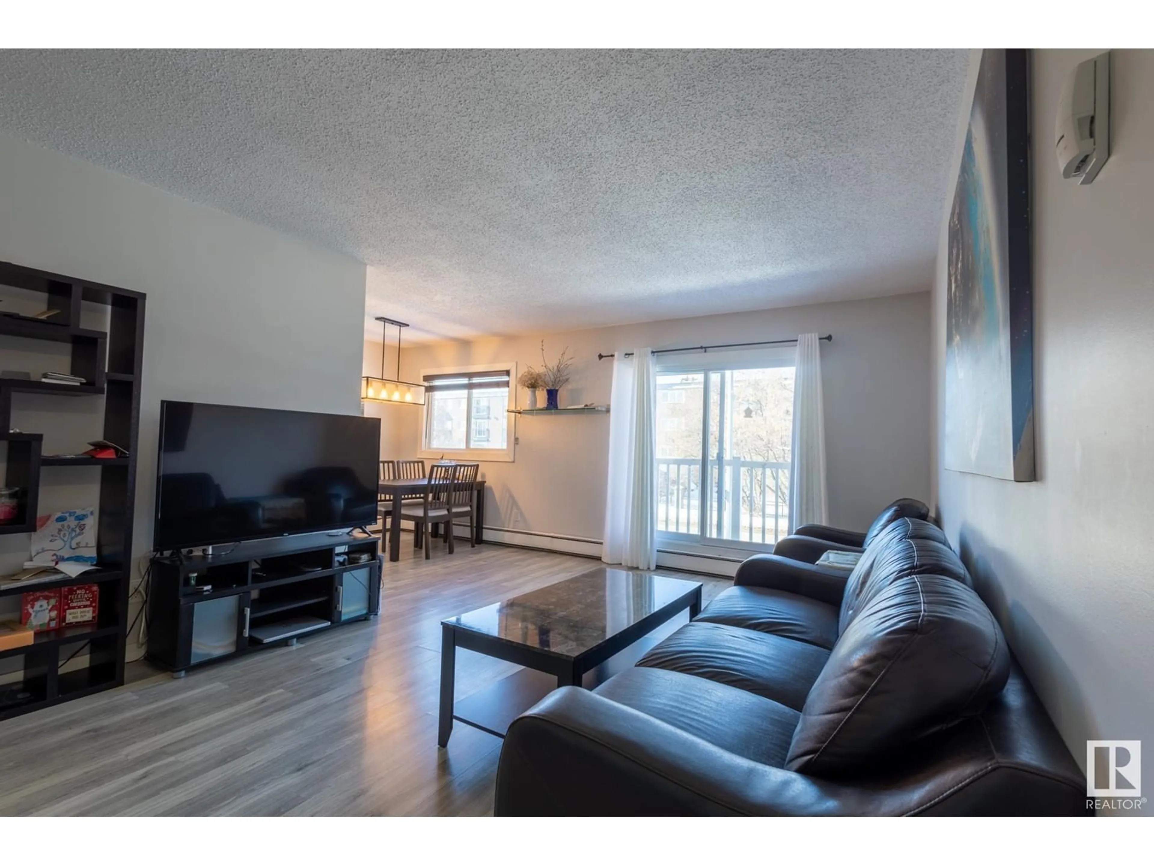 Living room with furniture, wood/laminate floor for #202 10615 156 ST NW, Edmonton Alberta T5P2S2