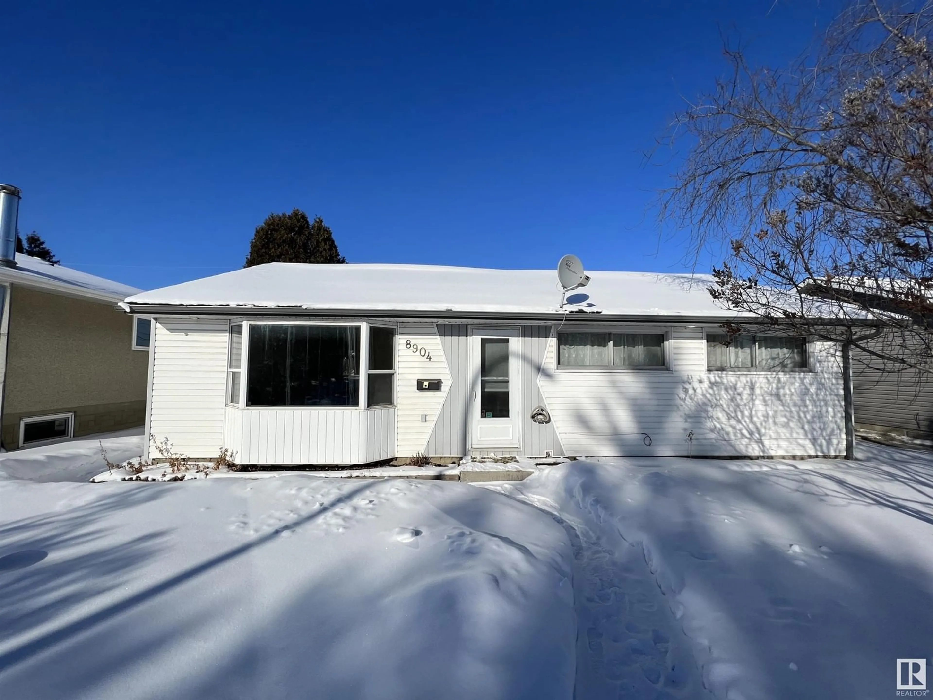 Home with vinyl exterior material, street for 8904 129B AV NW, Edmonton Alberta T5E0P2