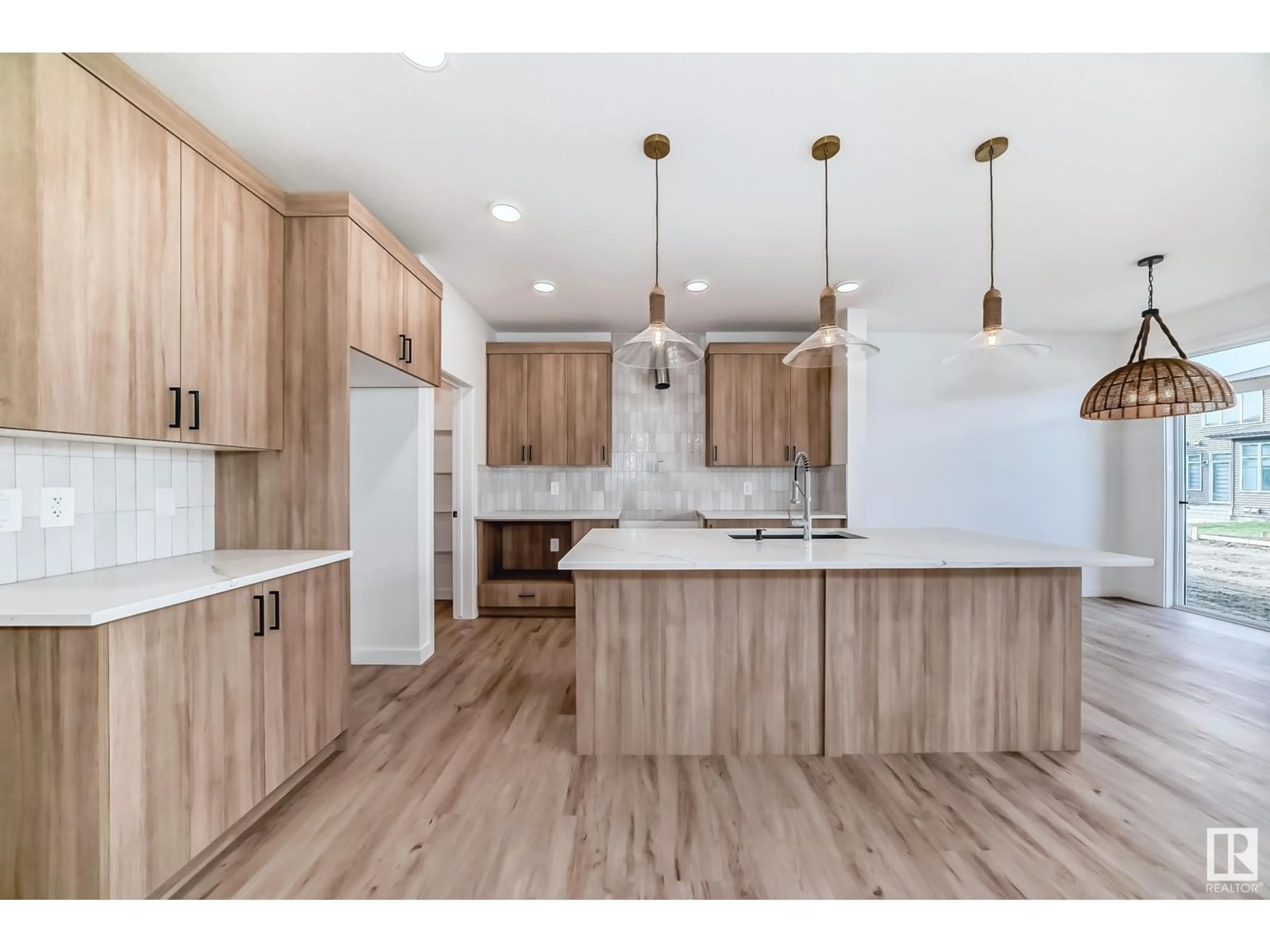 Open concept kitchen, wood/laminate floor for 5442 KOOTOOK RD, Edmonton Alberta T6W4Z7