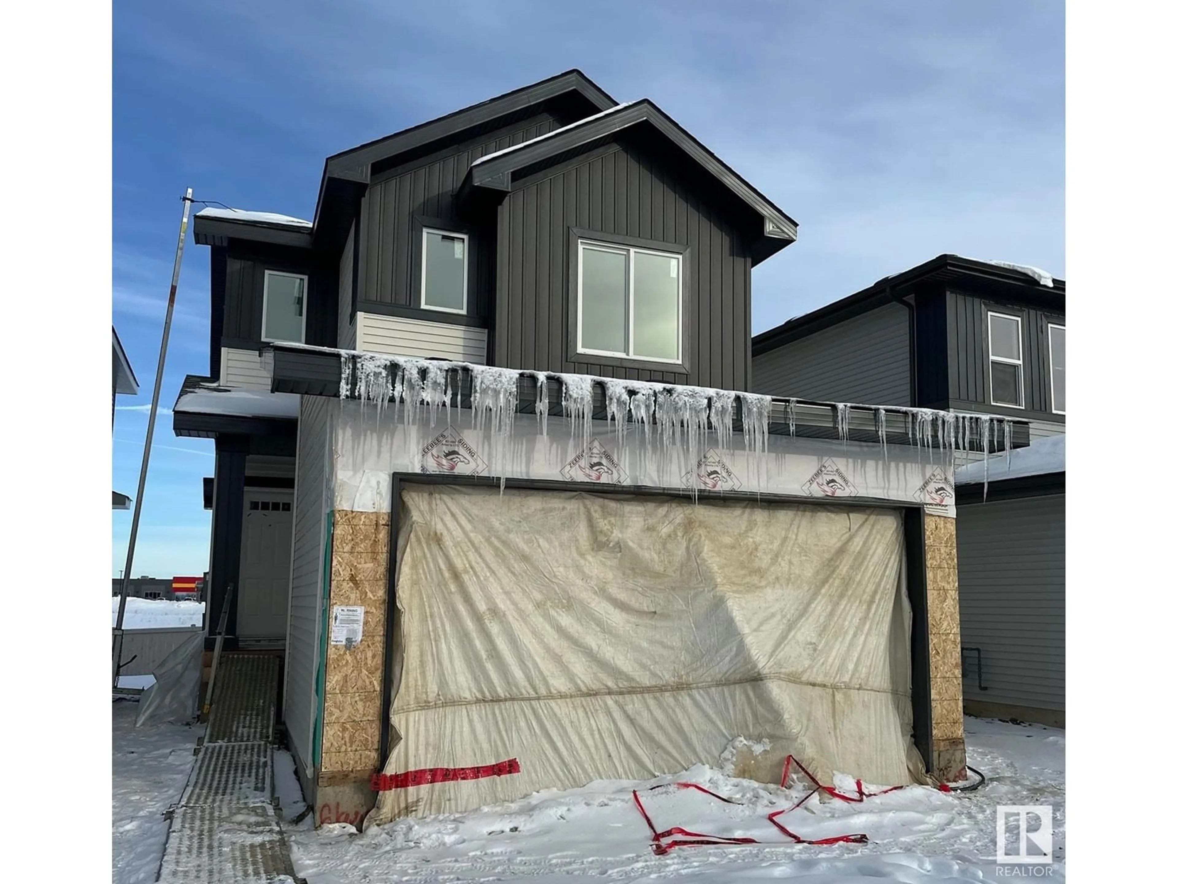 Home with vinyl exterior material, street for 9205 102 ST, Morinville Alberta T8R2R4