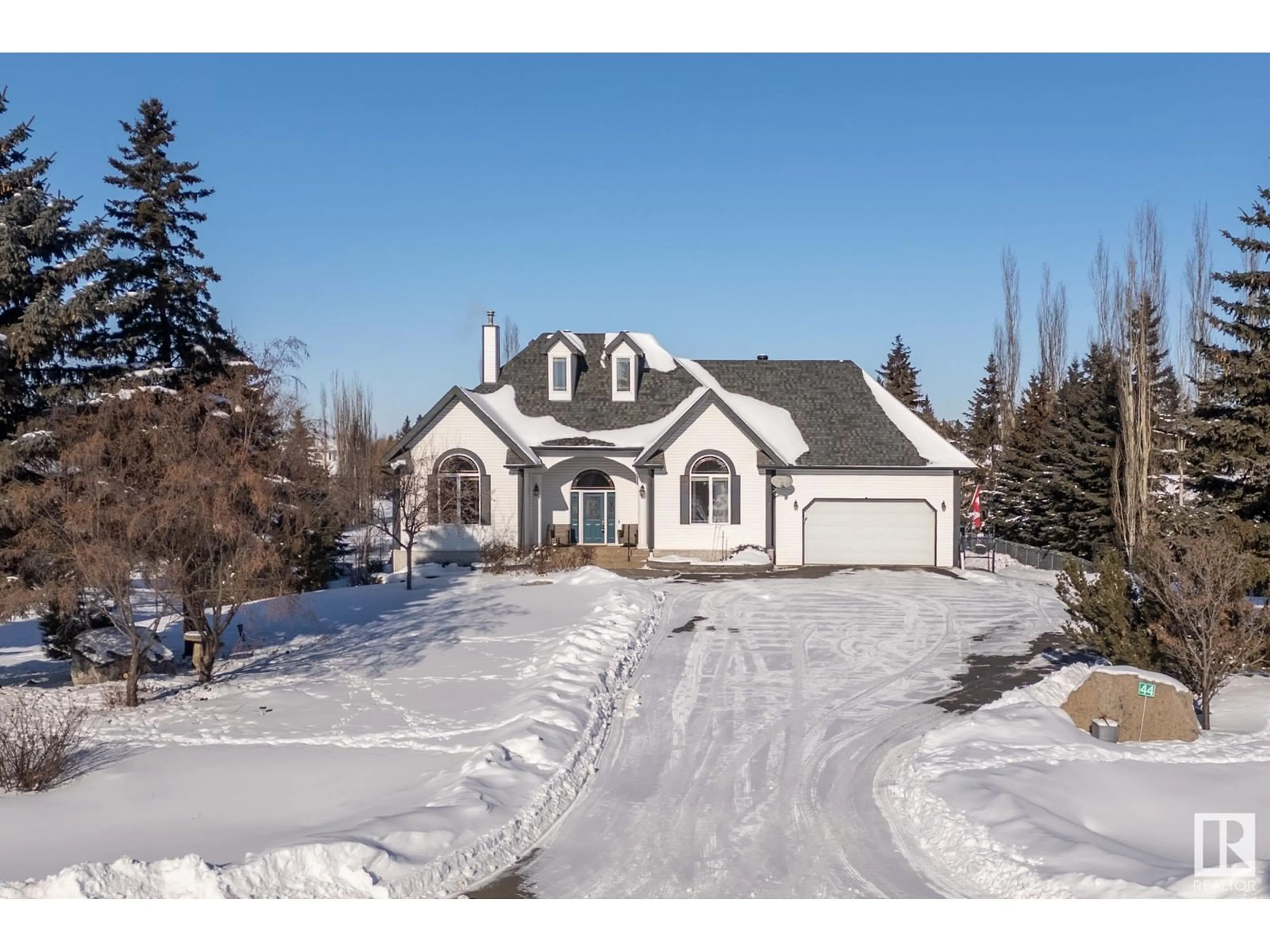 A pic from outside/outdoor area/front of a property/back of a property/a pic from drone, street for #44 26106 TWP ROAD 532 A, Rural Parkland County Alberta T7Y1A3