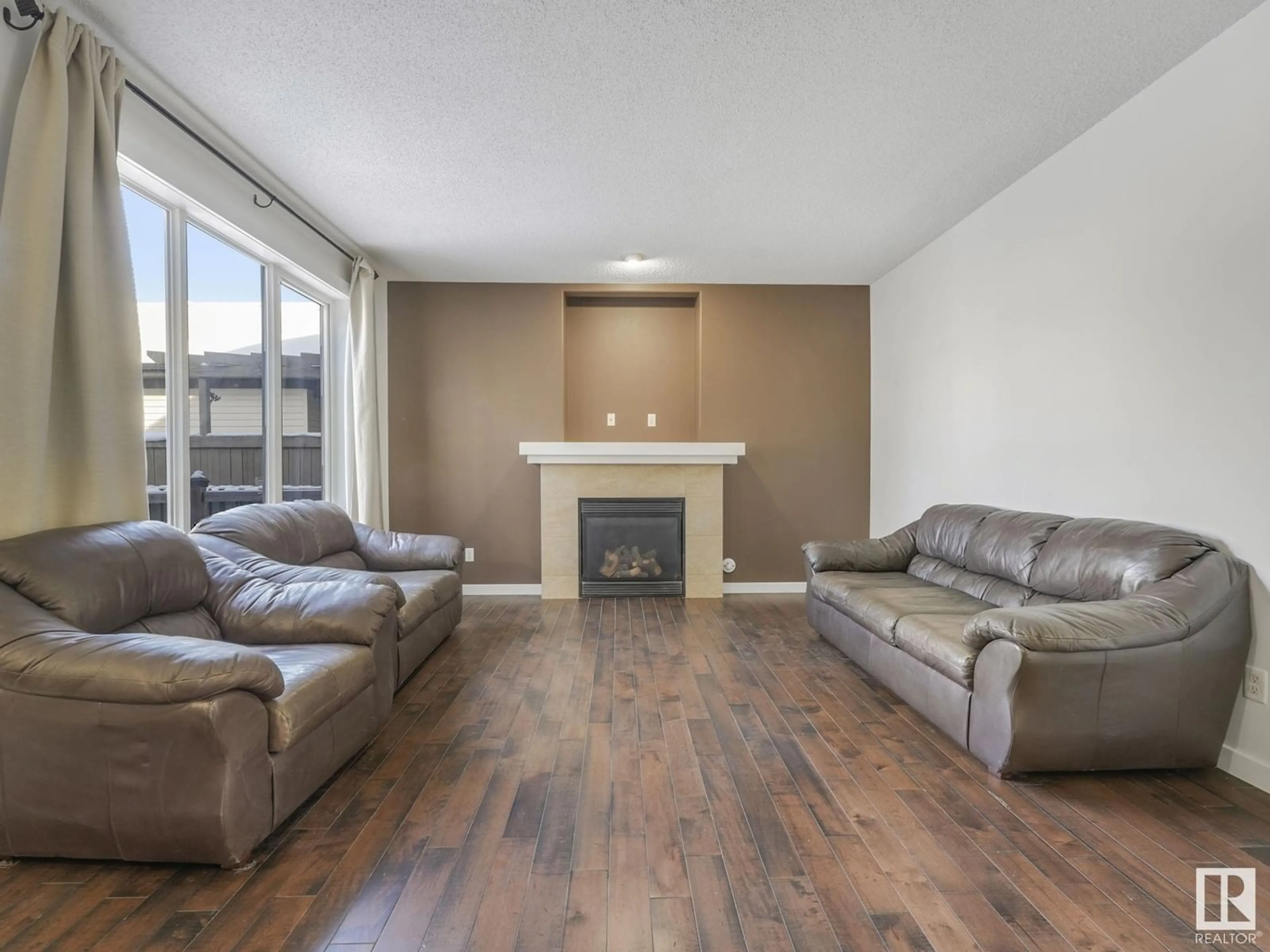 Living room with furniture, wood/laminate floor for 2020 125 ST SW, Edmonton Alberta T6W0A4