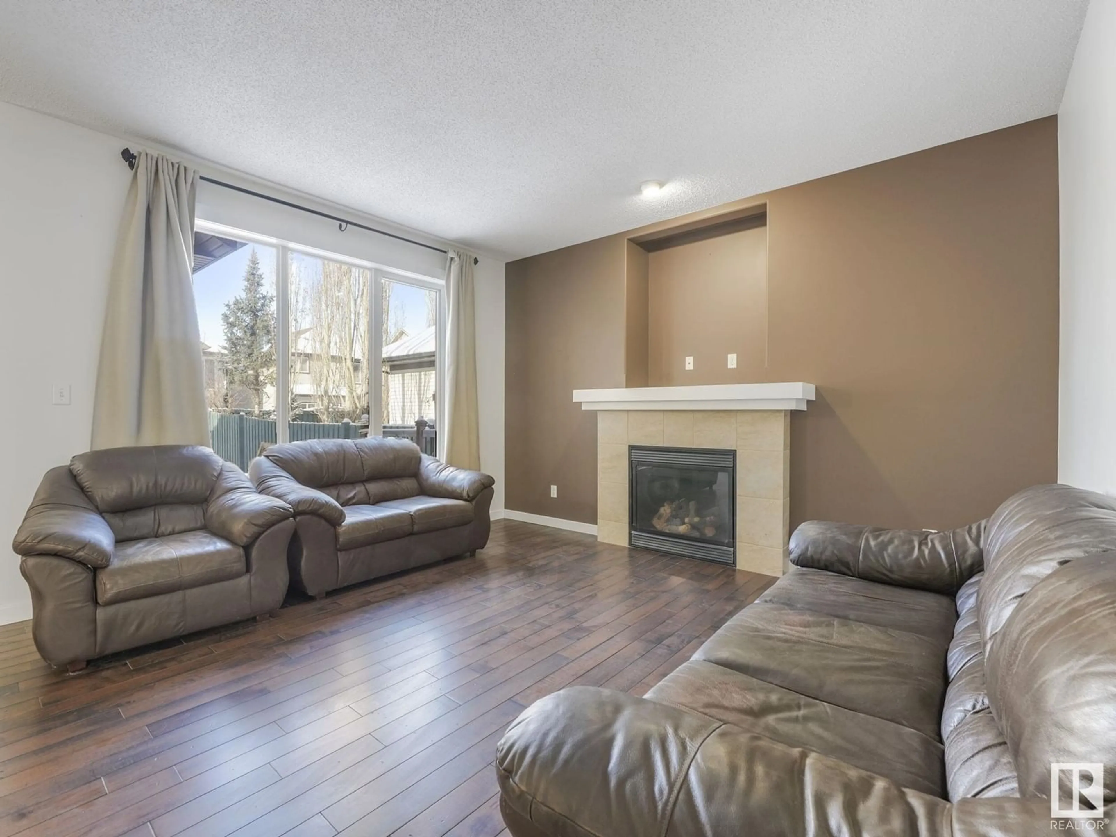 Living room with furniture, wood/laminate floor for 2020 125 ST SW, Edmonton Alberta T6W0A4