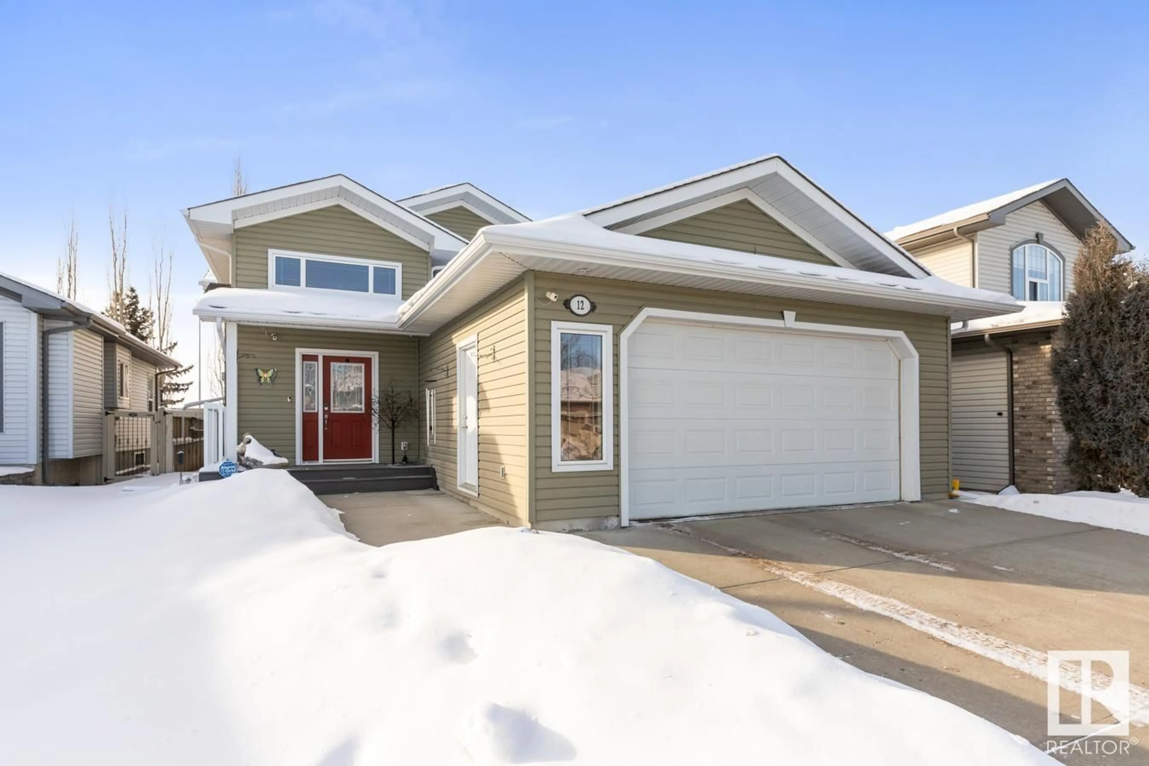 Home with vinyl exterior material, street for 12 WILLOWBY CL, Stony Plain Alberta T7Z2W6