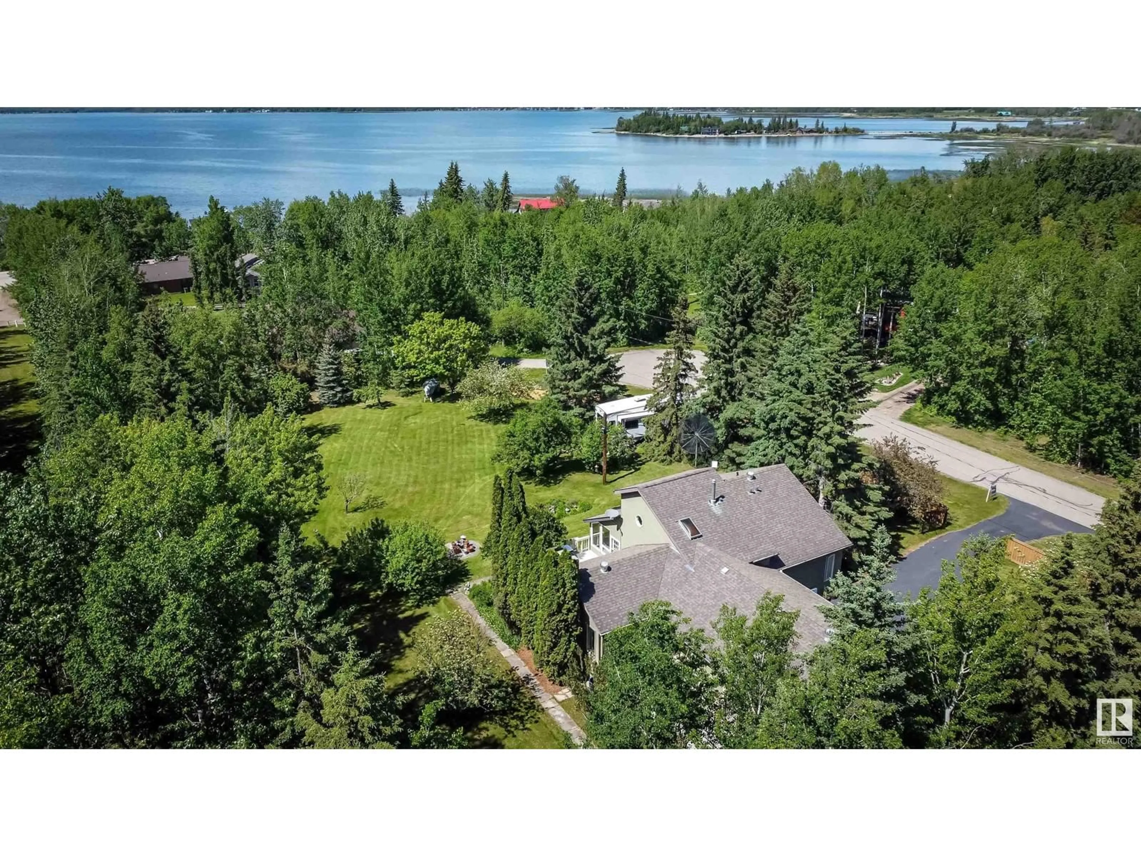 A pic from outside/outdoor area/front of a property/back of a property/a pic from drone, water/lake/river/ocean view for 5622 & 5623 49 ST, Rural Lac Ste. Anne County Alberta T0E0A0