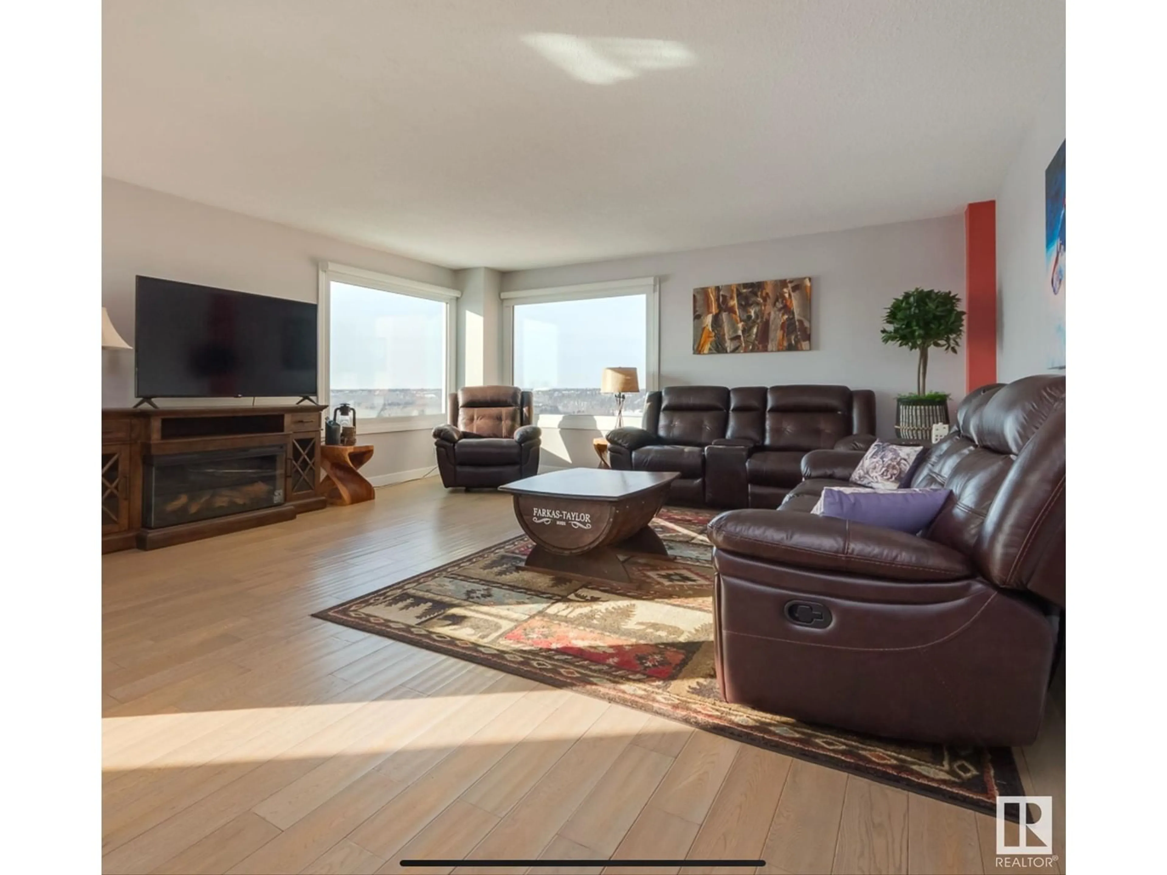 Living room with furniture, wood/laminate floor for 12303 Jasper HV NW NW, Edmonton Alberta T5N3K7