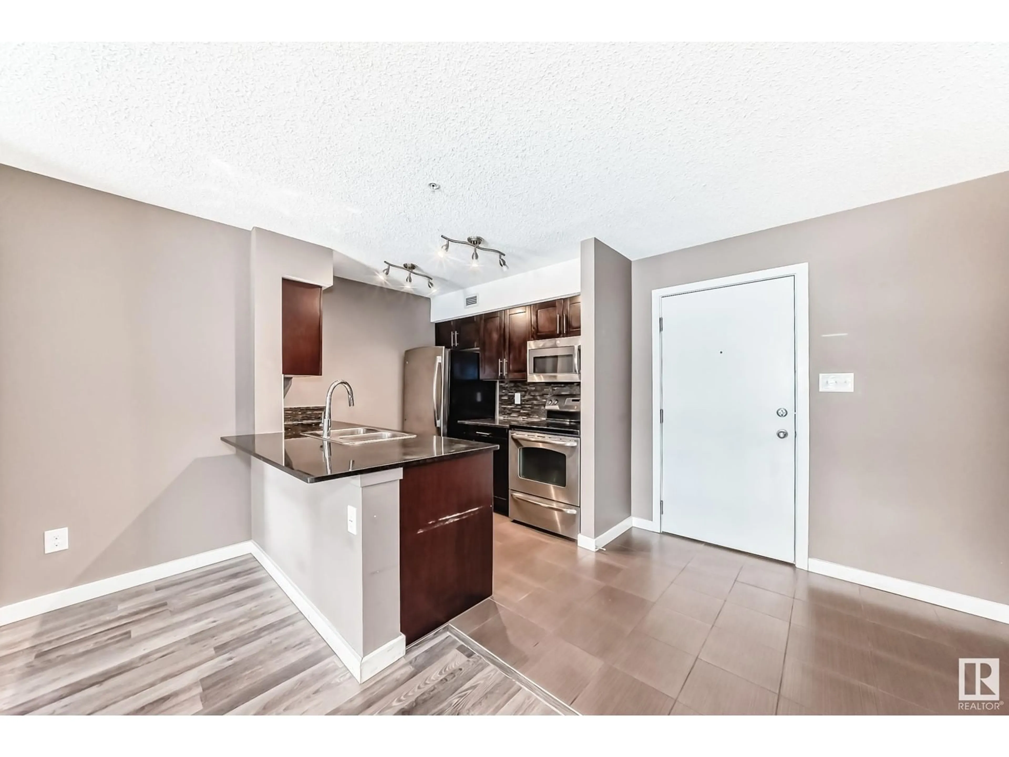 Open concept kitchen, ceramic/tile floor for #114 1060 MCCONACHIE BV NW, Edmonton Alberta T5Y0W9