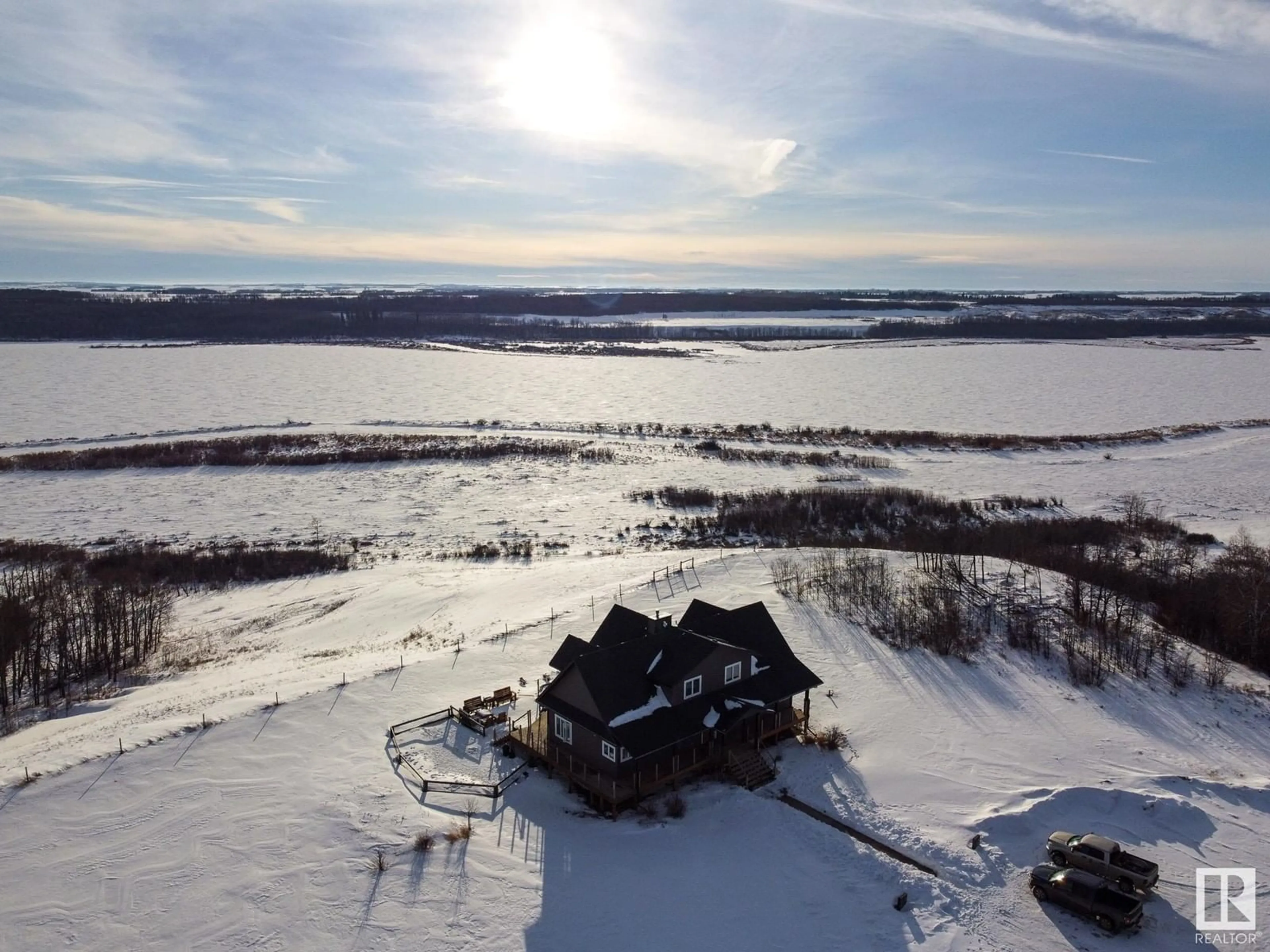 A pic from outside/outdoor area/front of a property/back of a property/a pic from drone, water/lake/river/ocean view for 20213 Township Road 460, Rural Camrose County Alberta T4V2M9