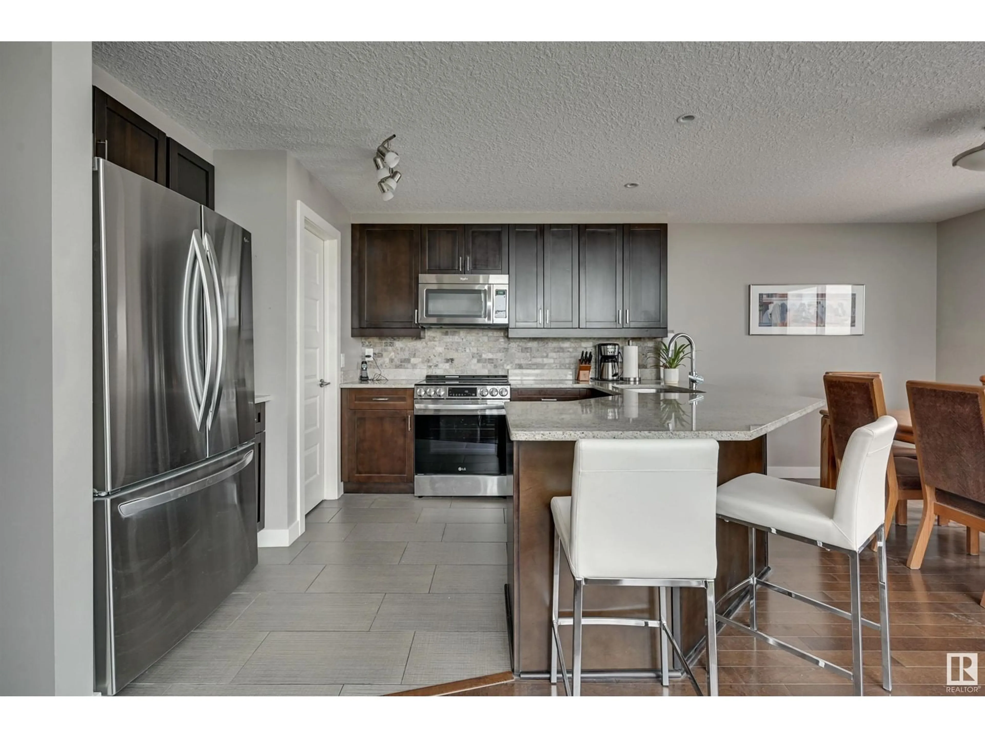 Open concept kitchen, ceramic/tile floor for #502 1230 WINDERMERE WY SW, Edmonton Alberta T6W2J3