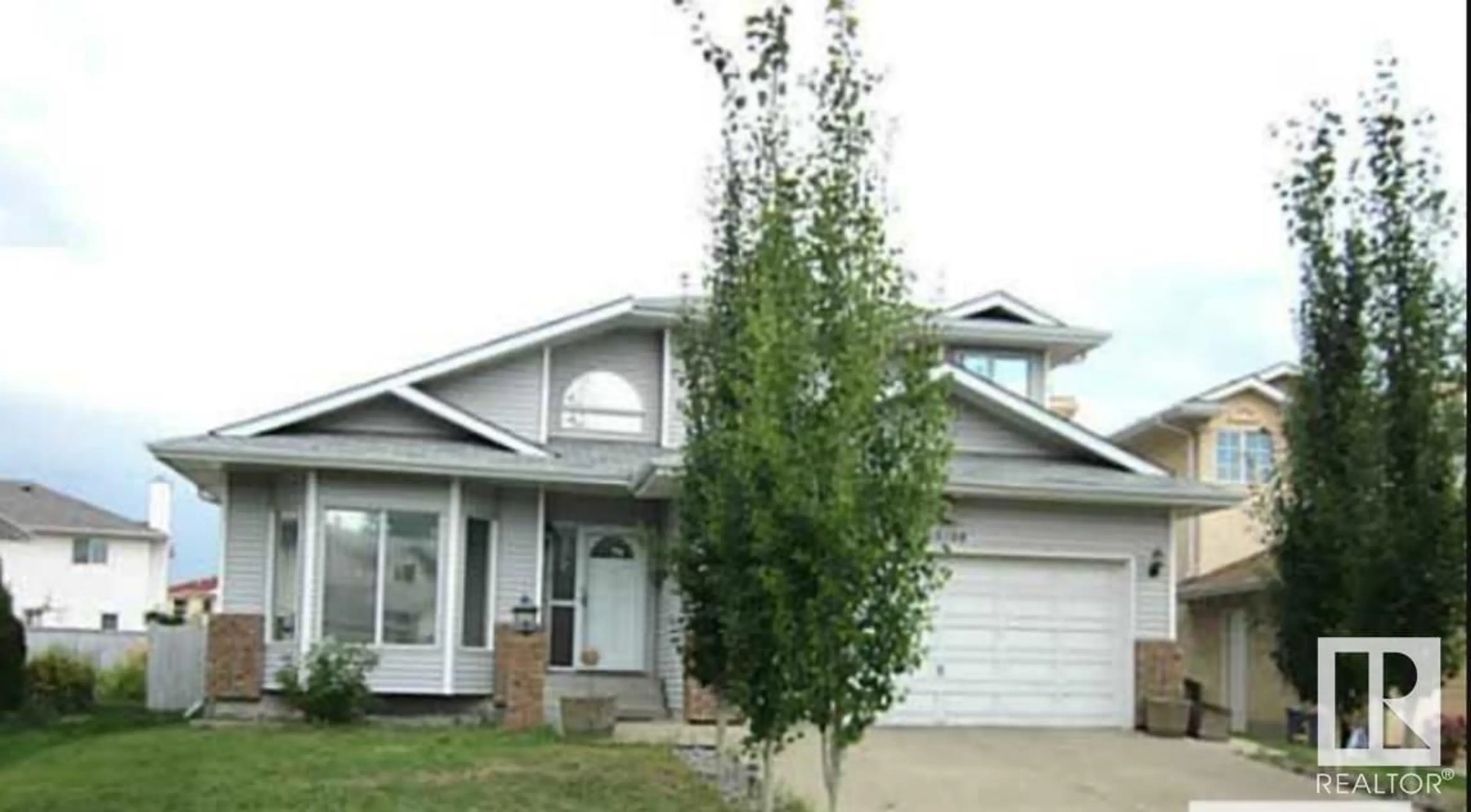 Home with vinyl exterior material, street for 10108 174 AV NW, Edmonton Alberta T5X5W3