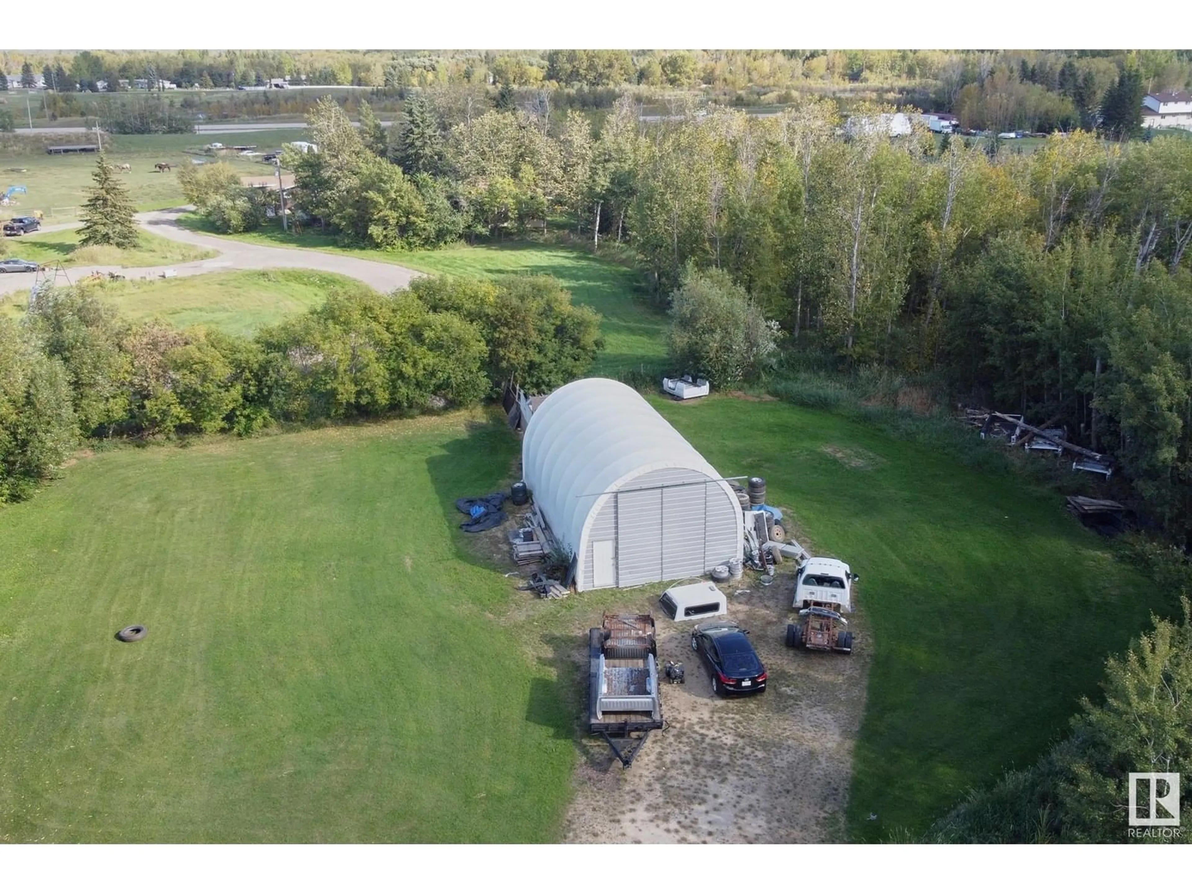 A pic from outside/outdoor area/front of a property/back of a property/a pic from drone, water/lake/river/ocean view for 23020 TWP ROAD 522 NW, Rural Strathcona County Alberta T8B1H1