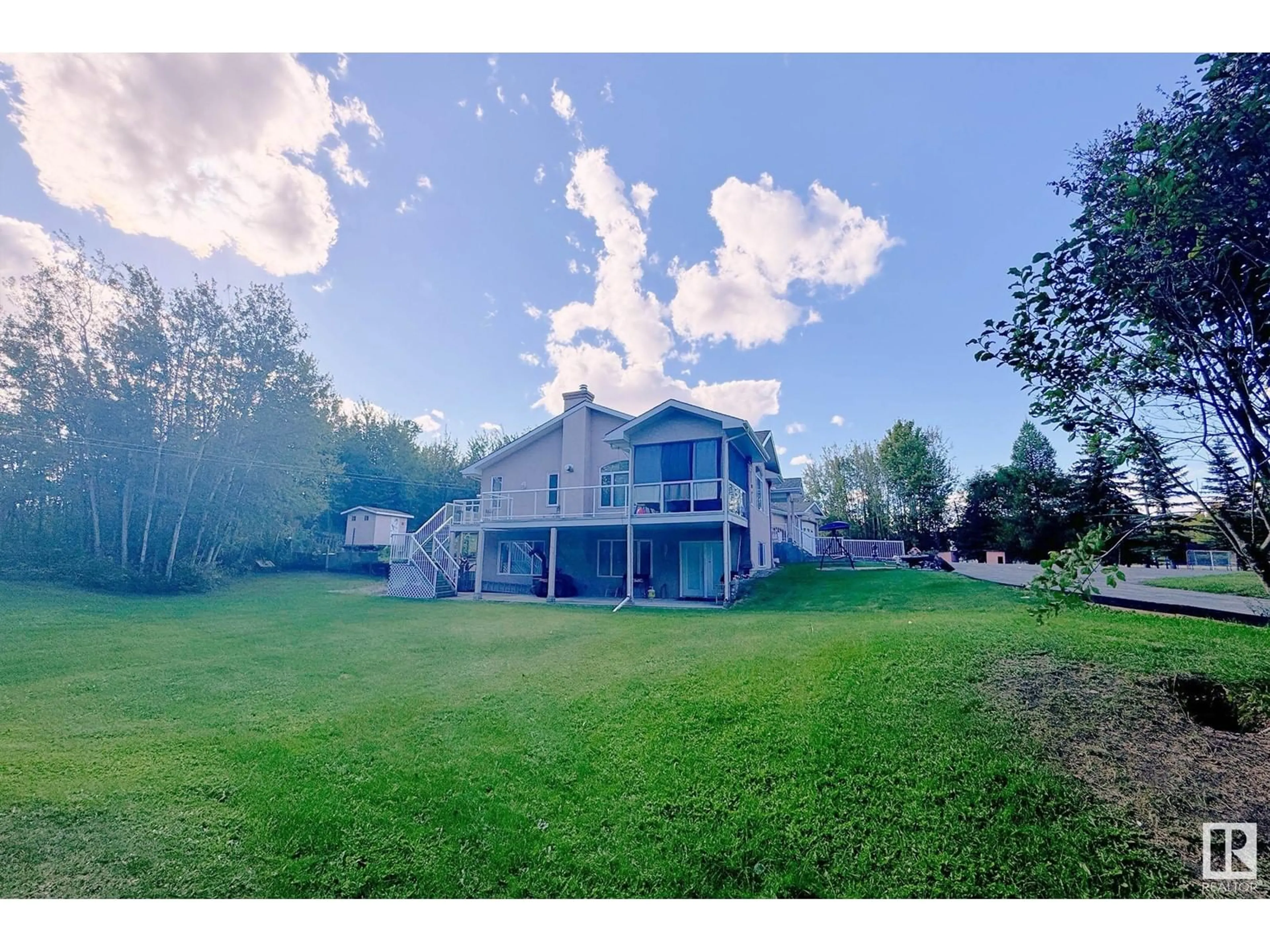 A pic from outside/outdoor area/front of a property/back of a property/a pic from drone, water/lake/river/ocean view for 23020 TWP ROAD 522 NW, Rural Strathcona County Alberta T8B1H1