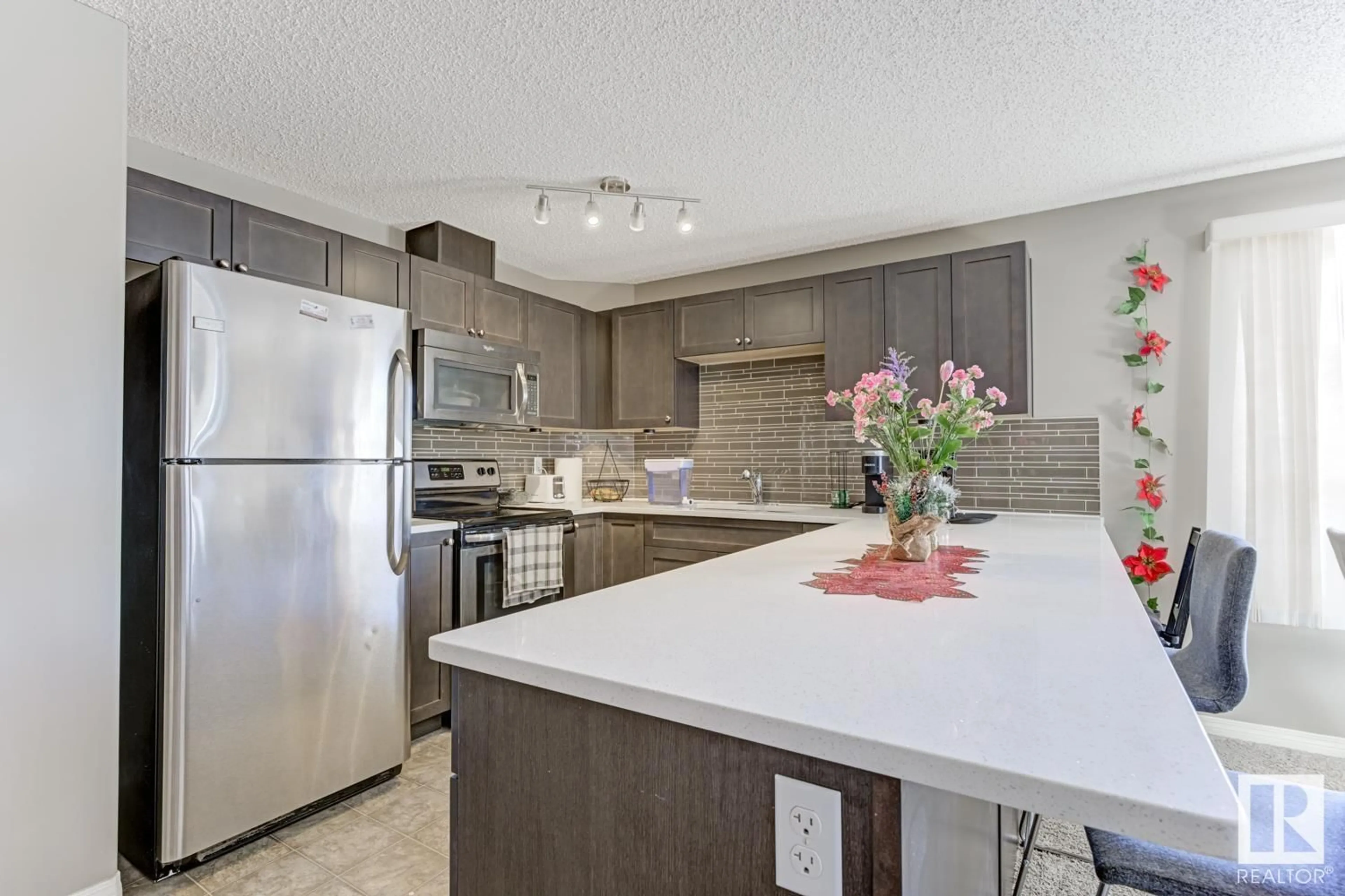 Open concept kitchen, ceramic/tile floor for #247 1520 HAMMOND GATE GA NW, Edmonton Alberta T6M0J4