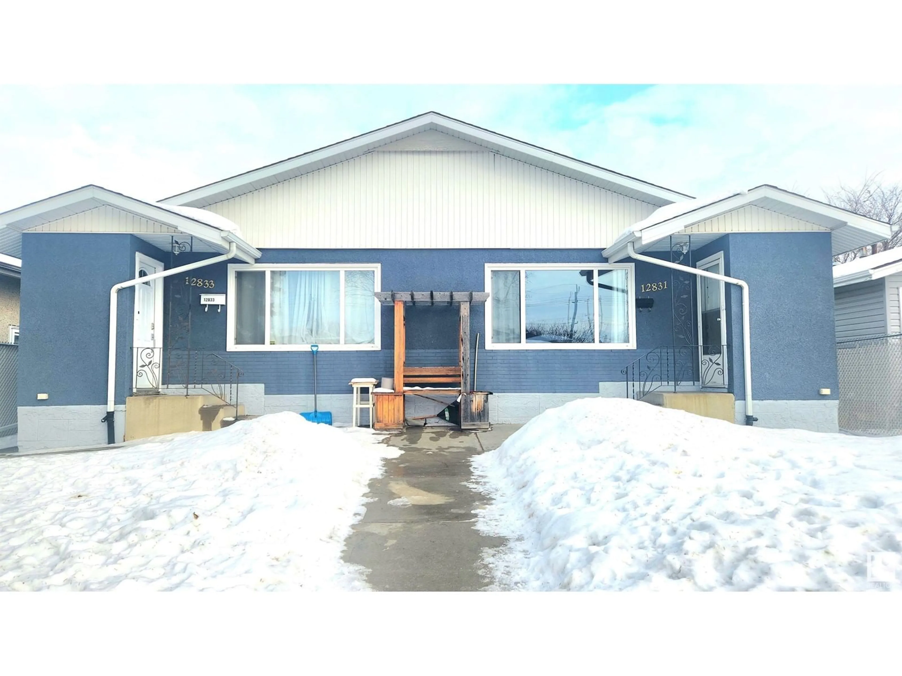 Home with vinyl exterior material, street for 12831/33 102 ST NW, Edmonton Alberta T5E4J2