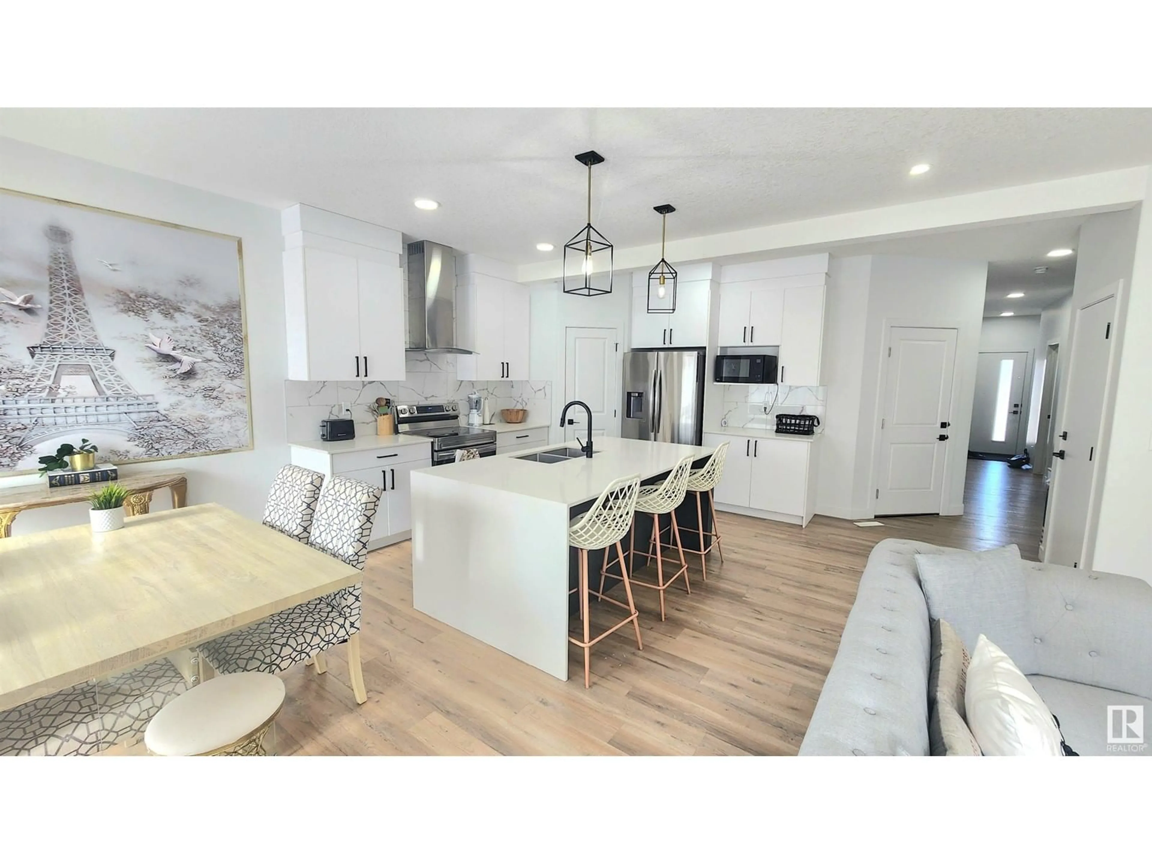 Open concept kitchen, wood/laminate floor for 5747 KOOTOOK WY SW, Edmonton Alberta T6W1A5