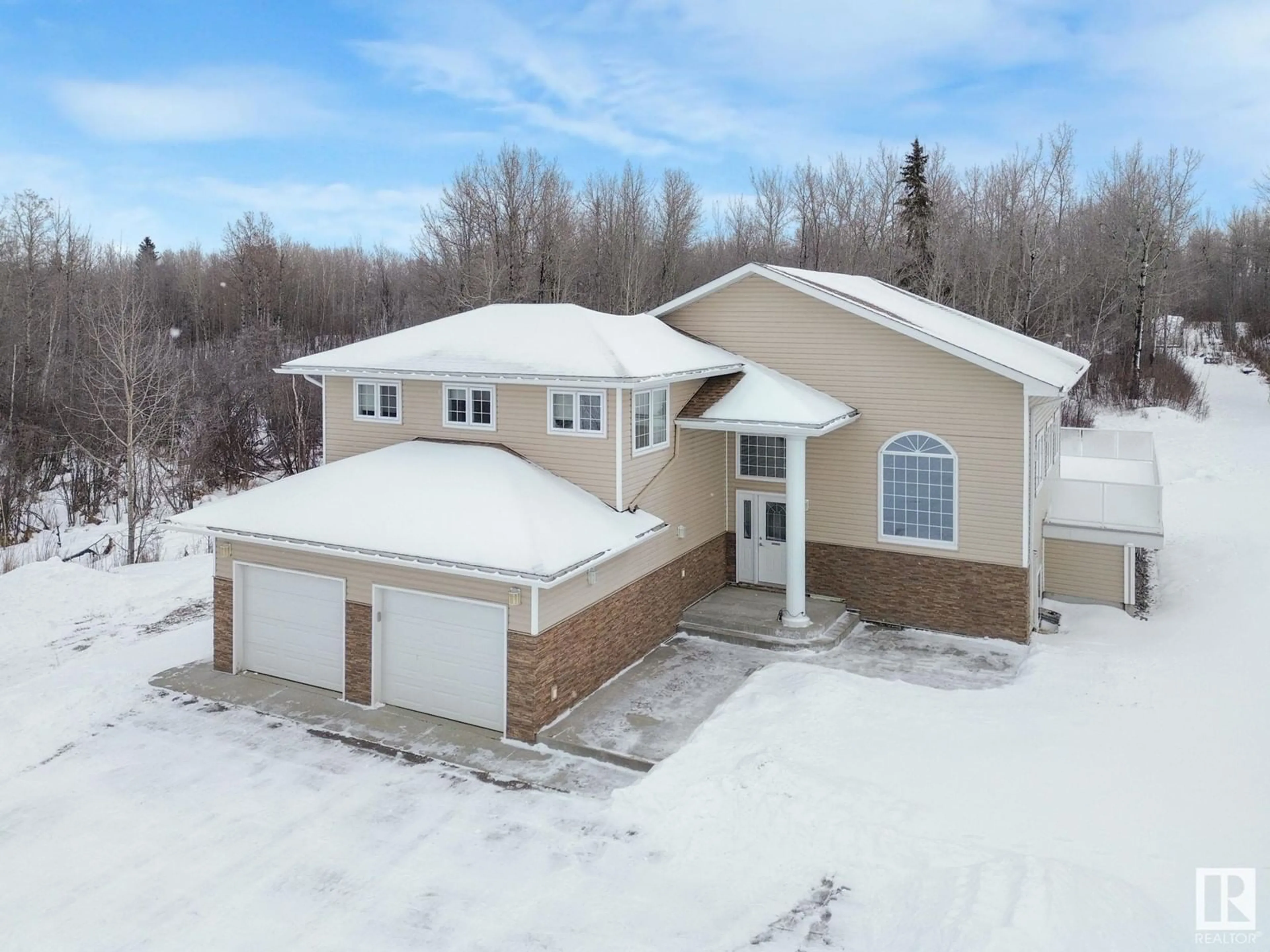 A pic from outside/outdoor area/front of a property/back of a property/a pic from drone, street for #17 54013 RGE RD 30, Rural Lac Ste. Anne County Alberta T0E1V3